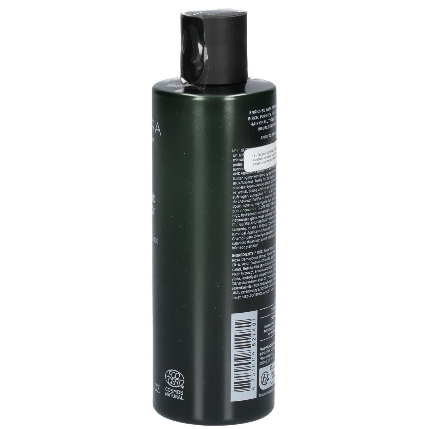 Retro di un flacone di shampoo verde. L'etichetta contiene ingredienti e istruzioni per l'uso.