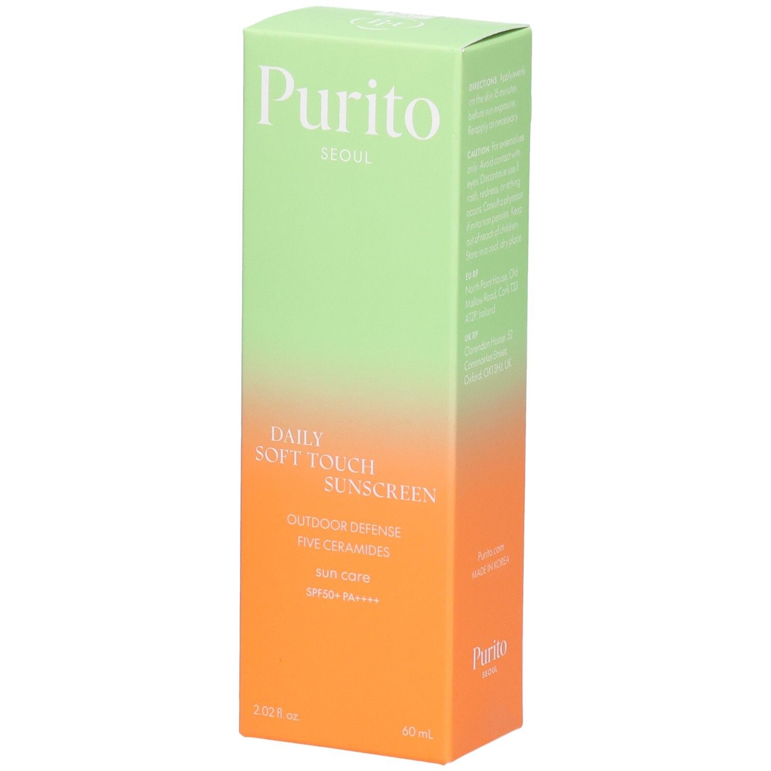 Scatola verde e arancione con informazioni sul prodotto. Testo: Purito, Daily Soft Touch Sunscreen, SPF 50+ PA++++.