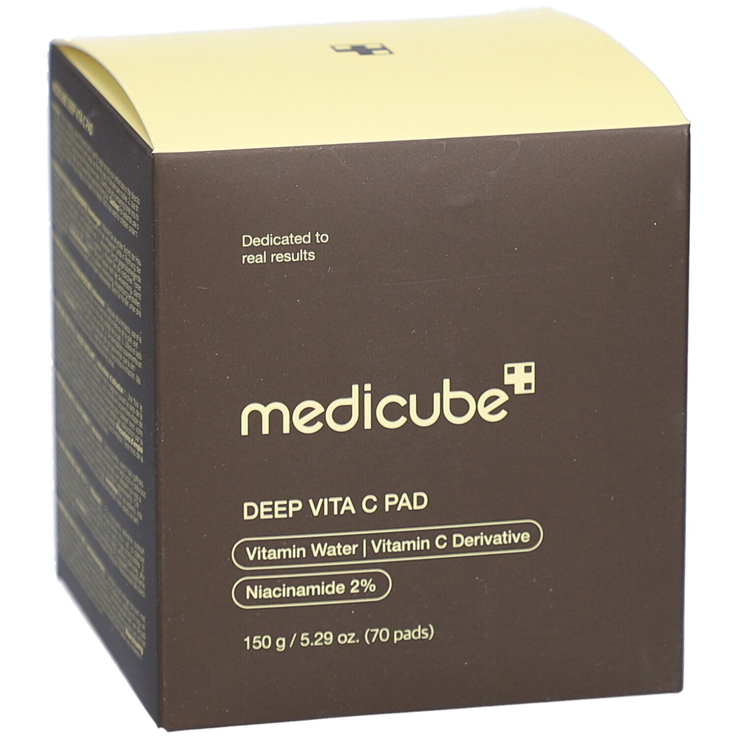Scatola marrone con coperchio giallo. Scritte: medicube, DEEP VITA C PAD, Vitamin Water, Vitamin C Derivative, Niacinamide 2%.