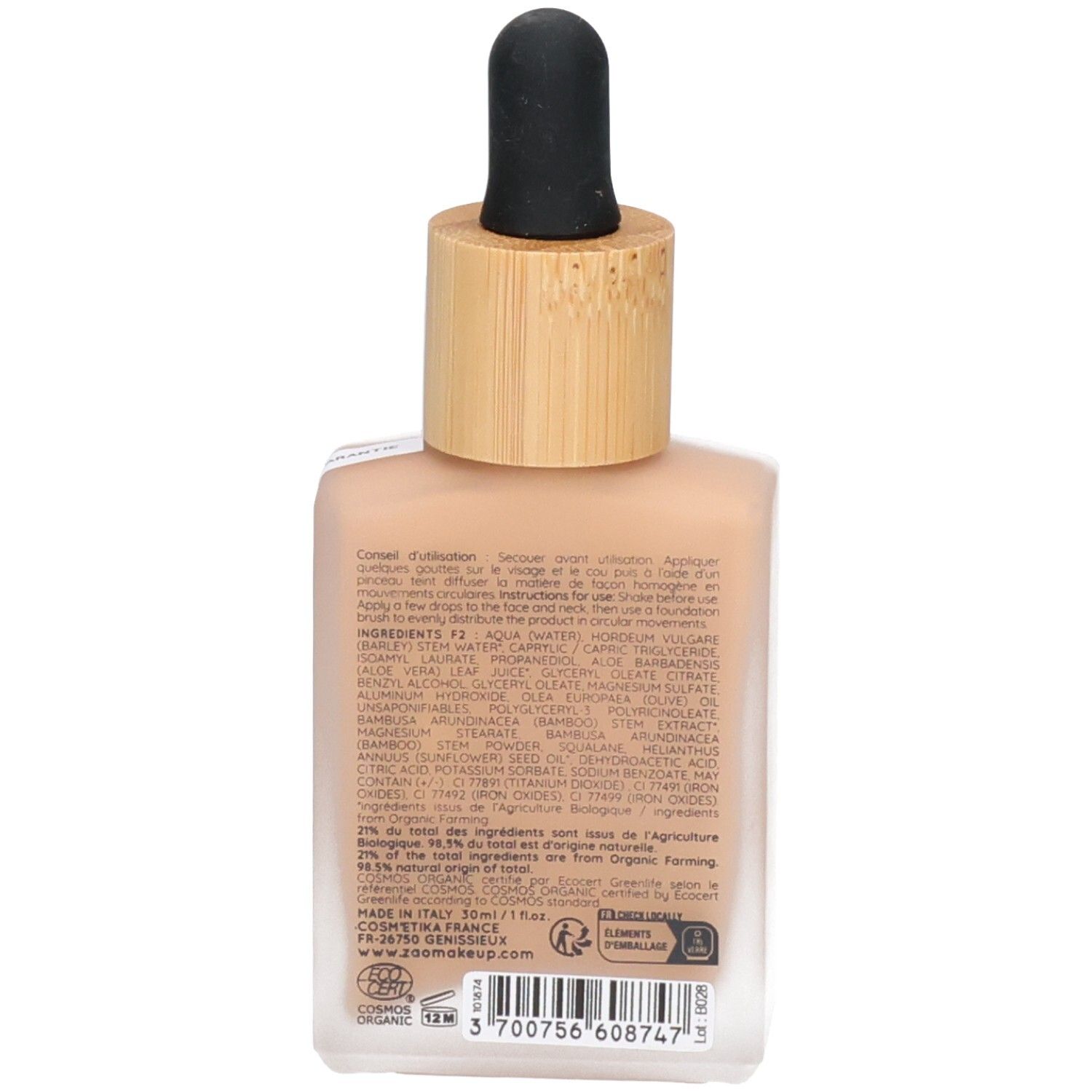 Retro del flacone di siero colorato. Scritte: ingredienti, istruzioni per l'uso. Certificazione bio. Prodotto in Italia.