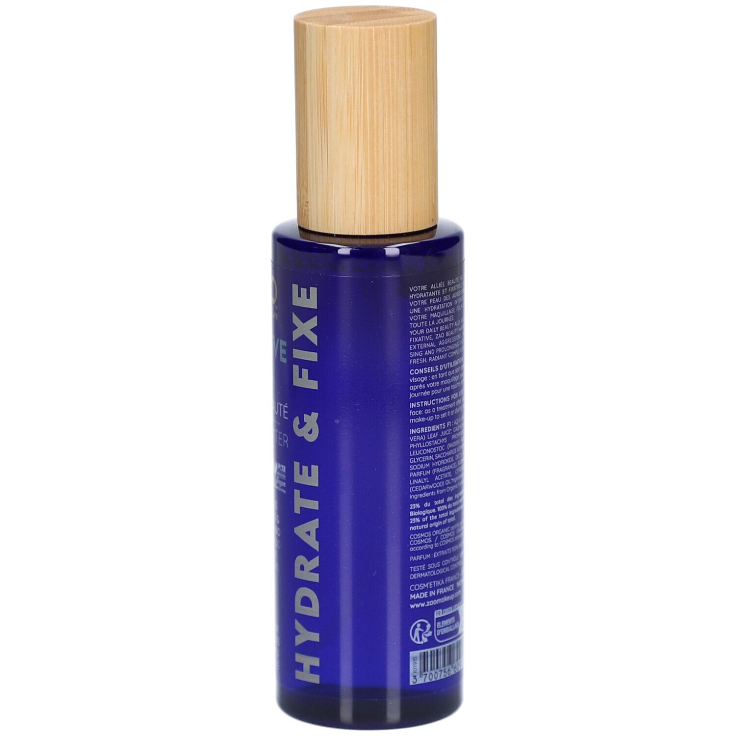 Retro di un flacone blu con tappo in legno. Testo: ingredienti, istruzioni per l'uso, informazioni sul produttore.