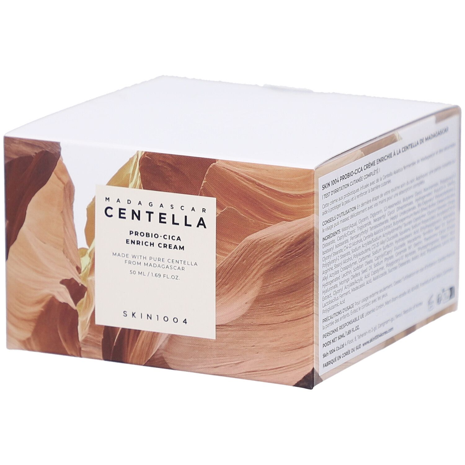 Scatola bianca con informazioni sul prodotto. Testo: MADAGASCAR CENTELLA, PROBIO-CICA ENRICH CREAM, SKIN1004.