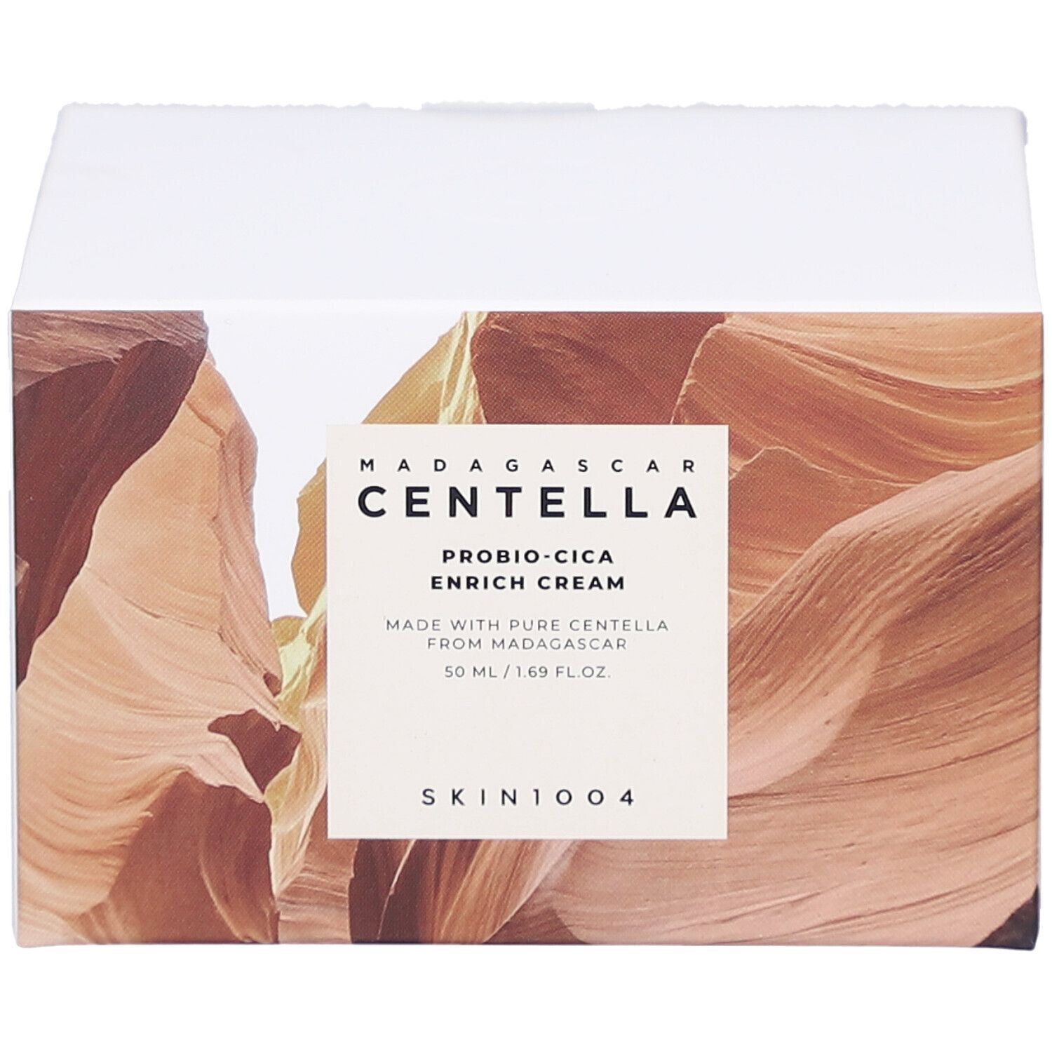 Scatola con informazioni sul prodotto. Testo: MADAGASCAR CENTELLA, PROBIO-CICA ENRICH CREAM, SKIN1004.