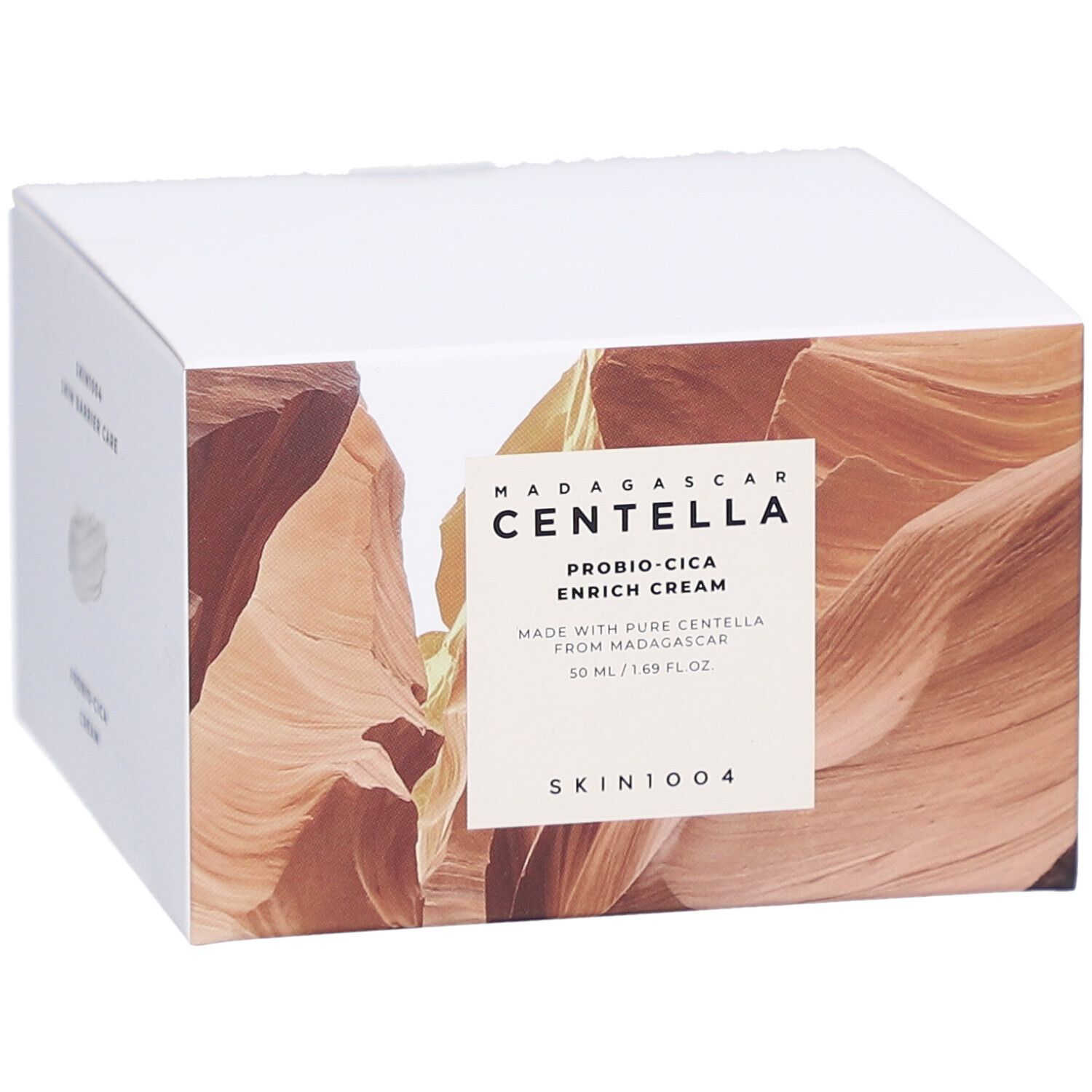 Scatola con informazioni sul prodotto. Testo: MADAGASCAR CENTELLA, PROBIO-CICA ENRICH CREAM, SKIN1004.