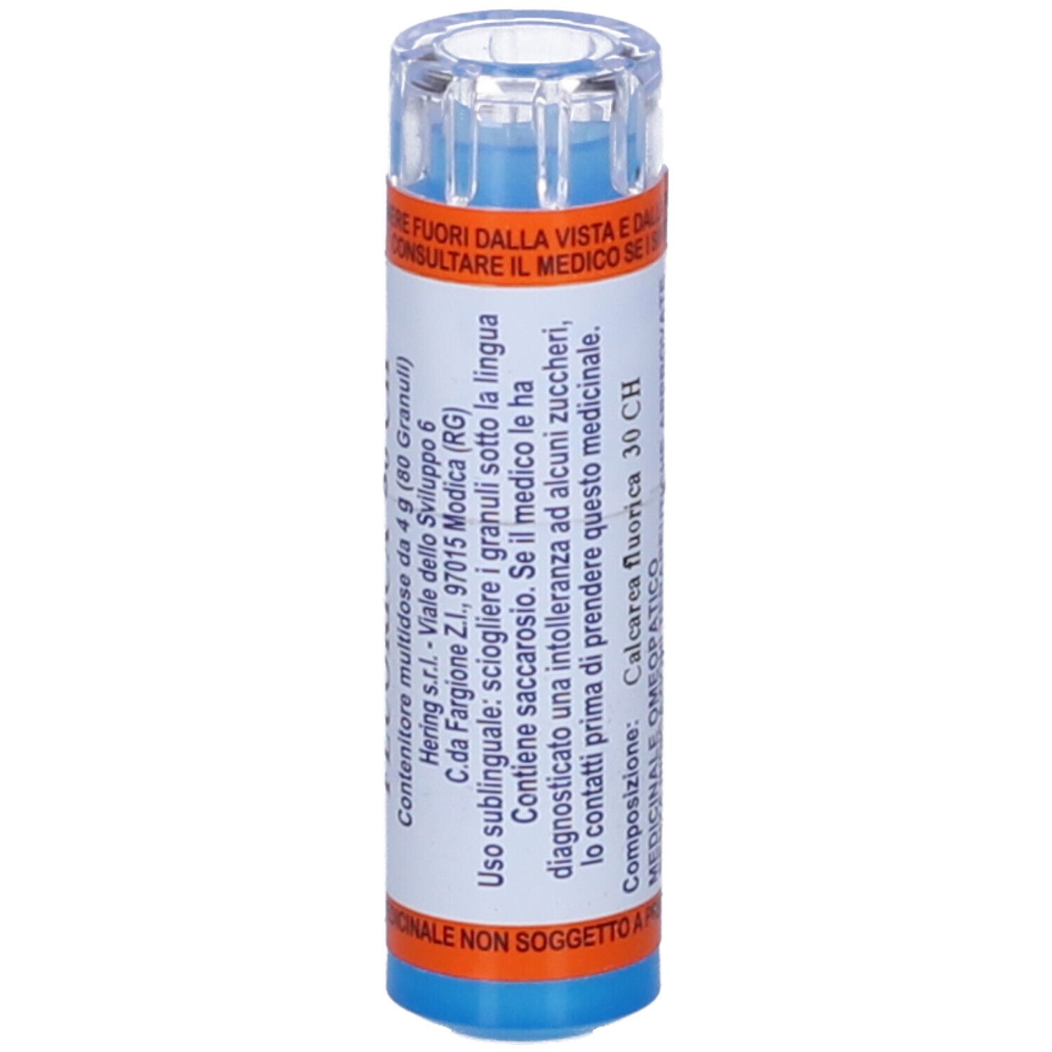 Flacone blu con etichetta bianca. Scritta: CALCAREA FLUORICA 30 CH. Istruzioni per l'uso. Coperchio trasparente. Dettagli arancioni.