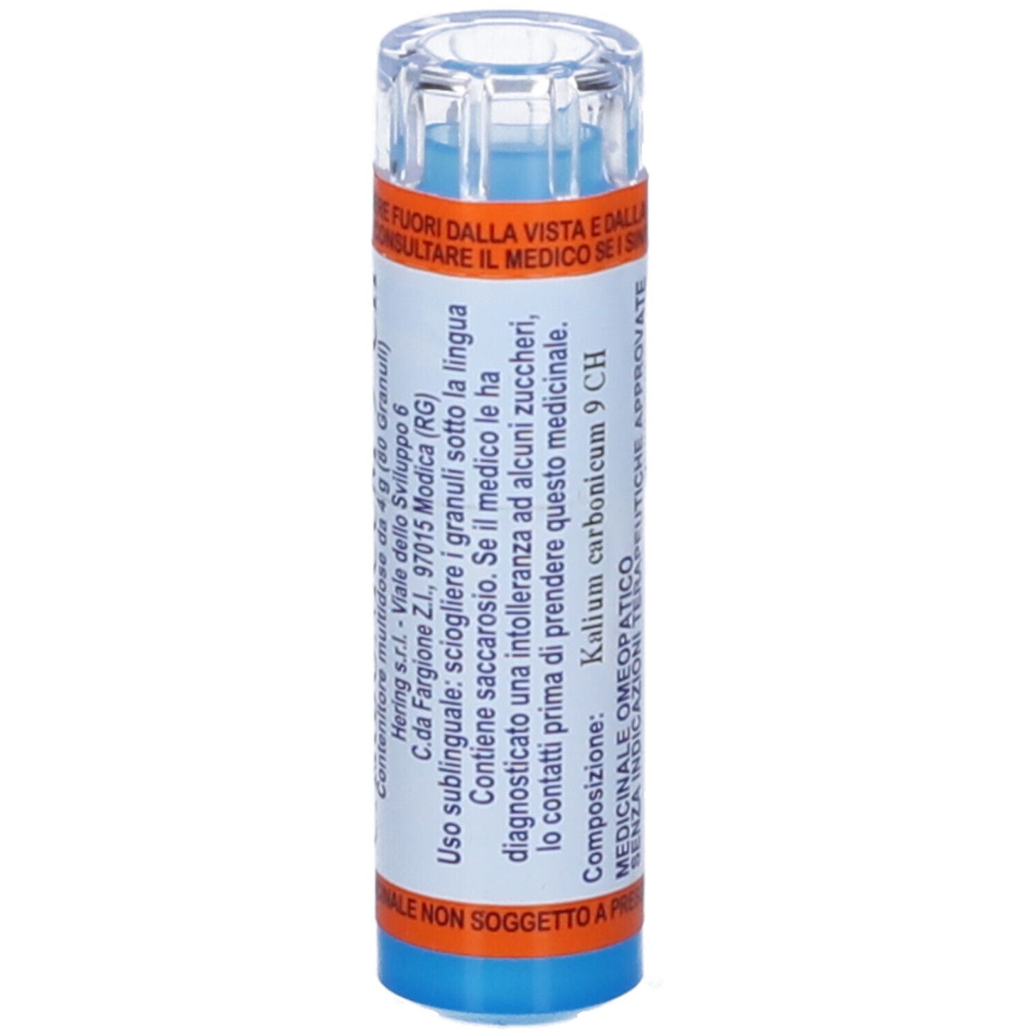 Contenitore multidose cilindrico. Scritta: KALIUM CARBONICUM 9 CH. Etichette arancioni e blu. Coperchio trasparente.
