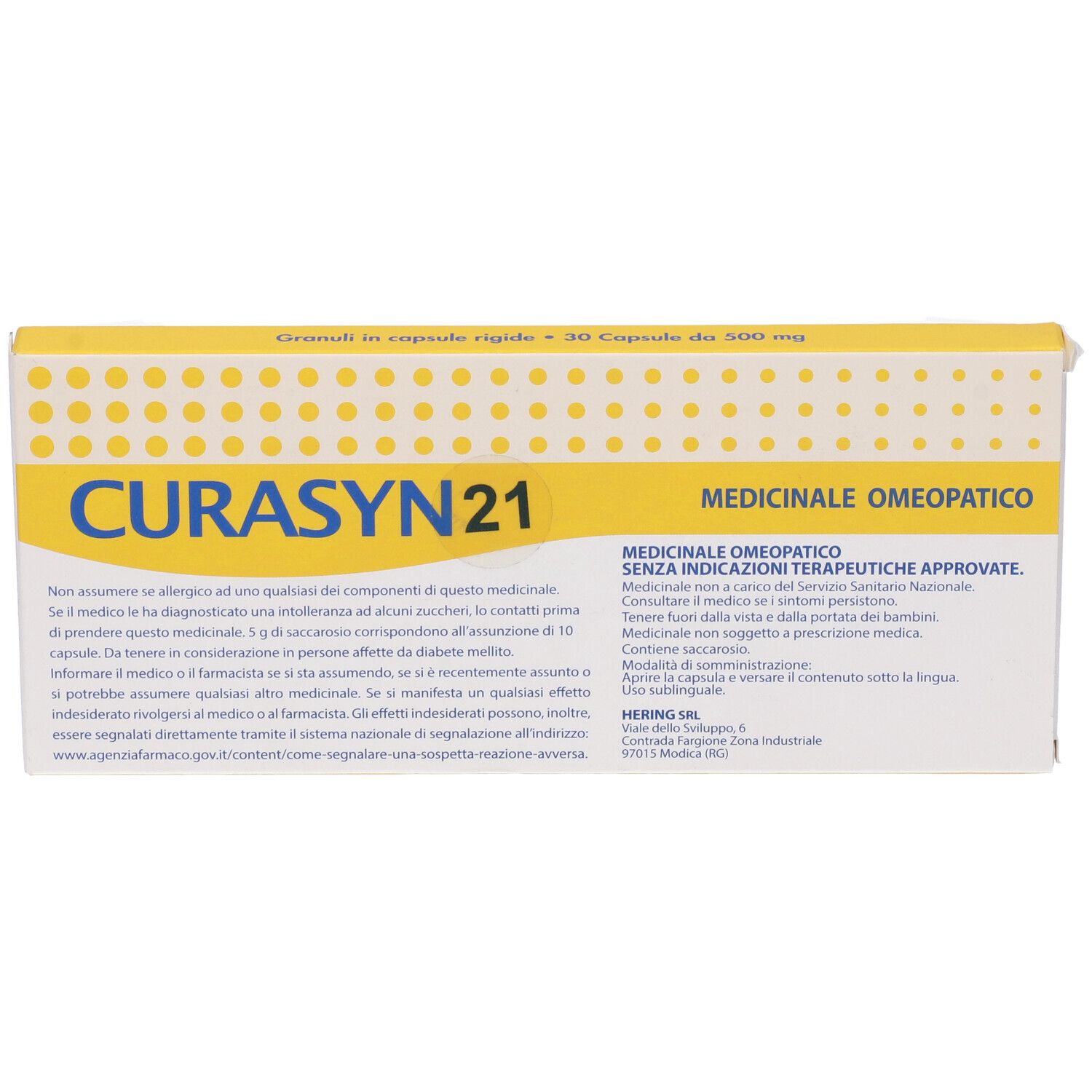 Scatola con coperchio giallo. Scritto "CURASYN 21". Testo: "Granuli in capsule rigide - 30 Capsule da 500 mg".