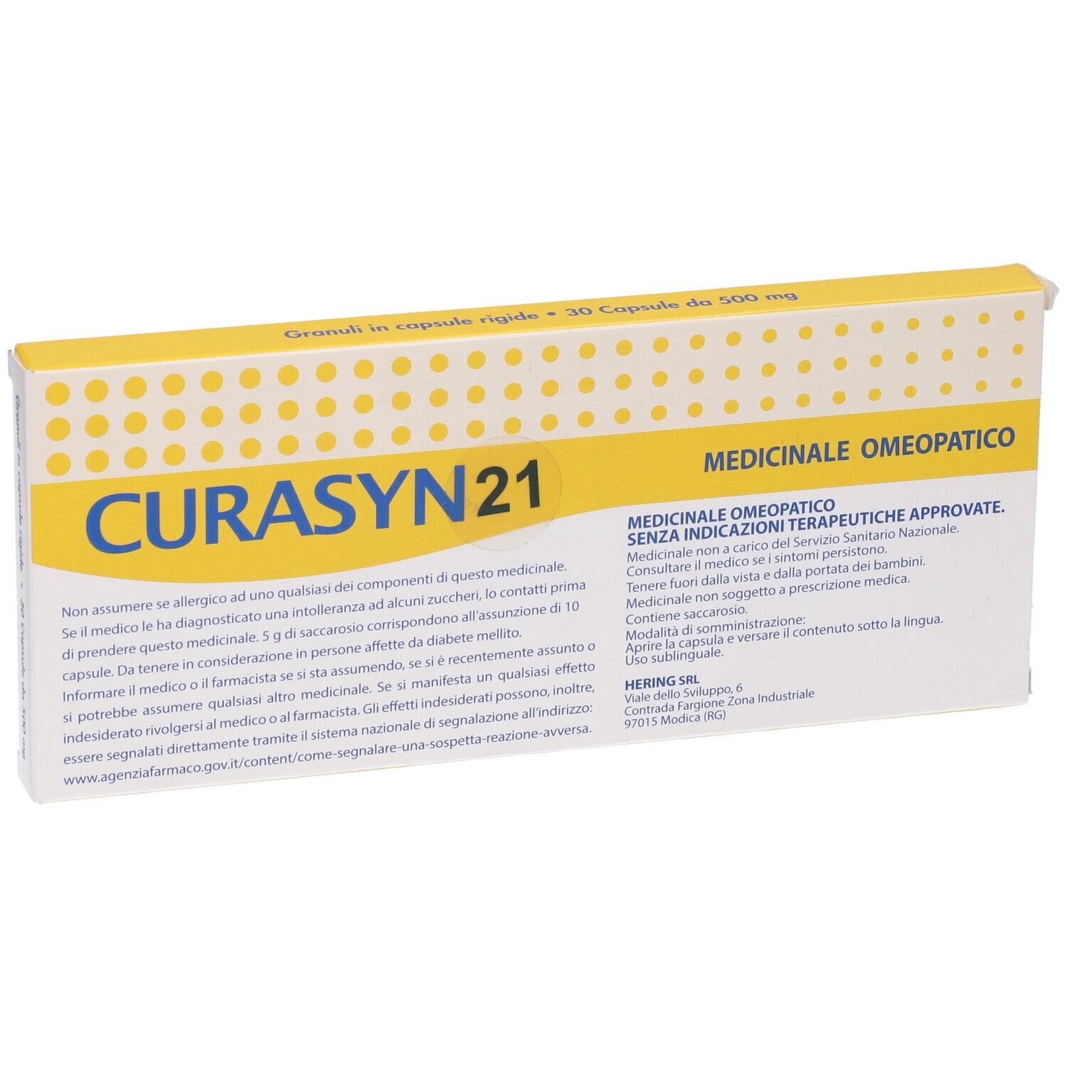 Scatola con coperchio giallo. Scritto "CURASYN 21". Testo: "Granuli in capsule rigide - 30 Capsule da 500 mg".