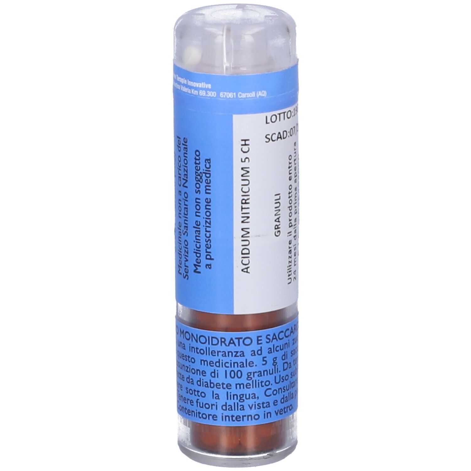 Contenitore cilindrico con etichetta blu e testo. Coperchio trasparente. Contiene granuli. 12 g.
