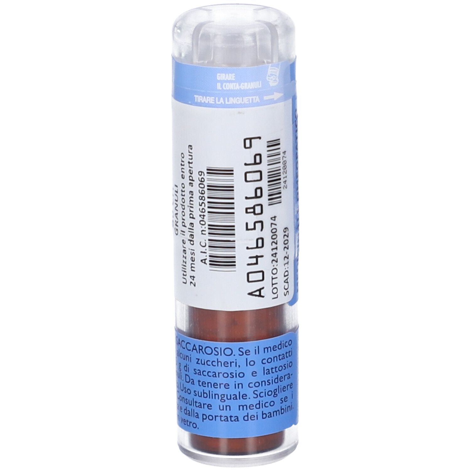 Confezione cilindrica blu. Contiene granuli. Coperchio trasparente. Testo e codice.