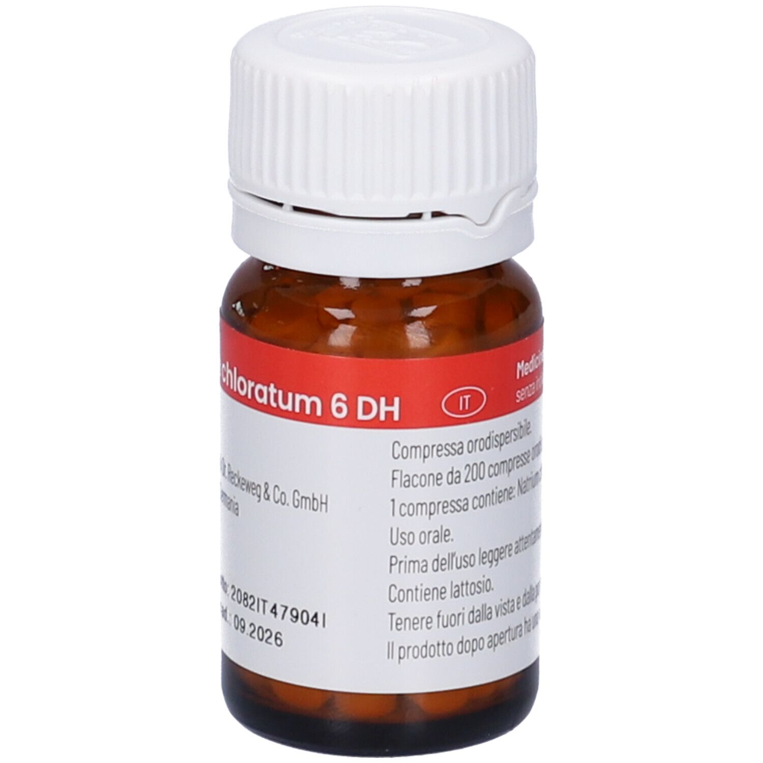 Flacone di vetro marrone con tappo bianco. Etichetta con informazioni sul prodotto. Compresse all'interno visibili. Codice a barre.