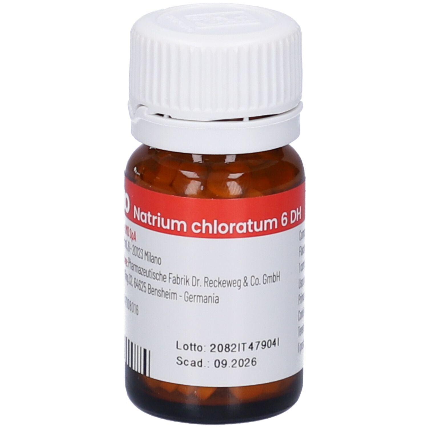 Flacone di vetro marrone con tappo bianco. Etichetta con informazioni sul prodotto. Compresse all'interno visibili. Codice a barre.