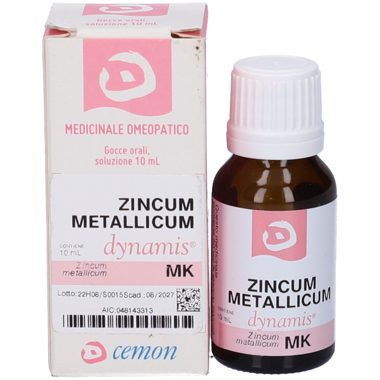 Flacone di vetro marrone con tappo bianco ed etichetta rosa. Accanto, una scatola rosa e bianca.