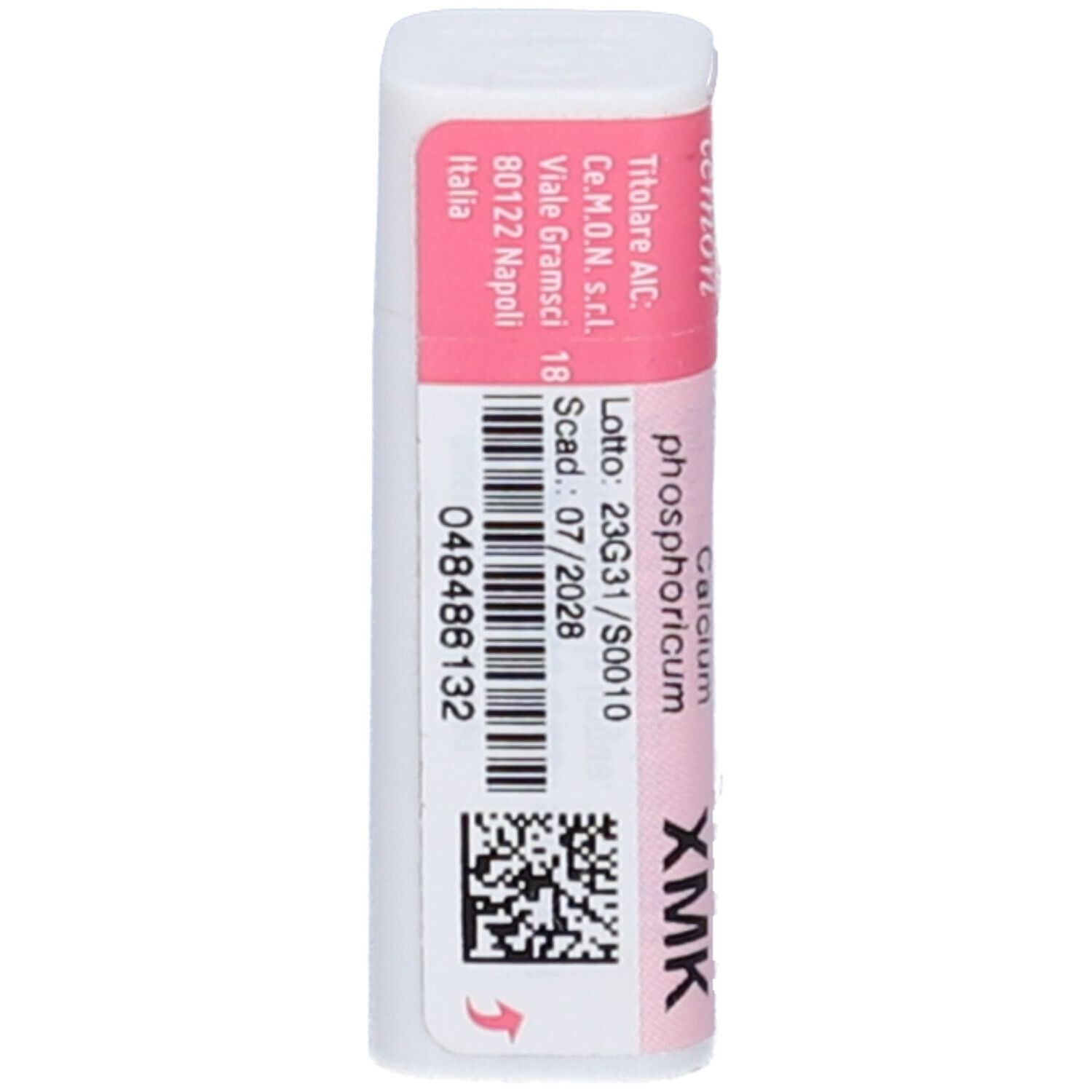 Confezione cilindrica. Etichette rosa e bianche con testo e codice a barre. Contiene: Calcium Phosphoricum XMK. Indirizzo e scadenza.