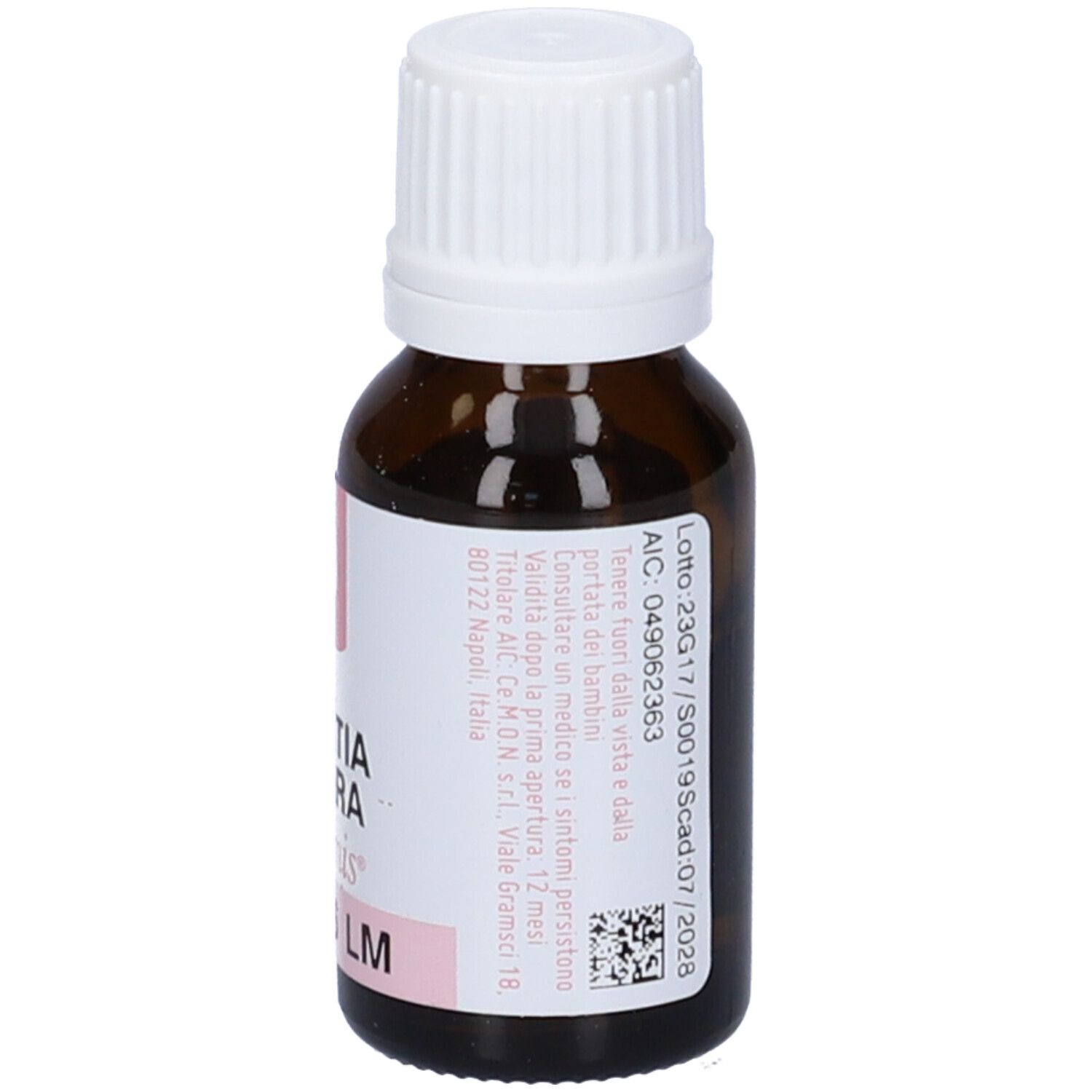 Flacone di vetro marrone con tappo bianco. Etichetta con testo, numero di lotto e data di scadenza.