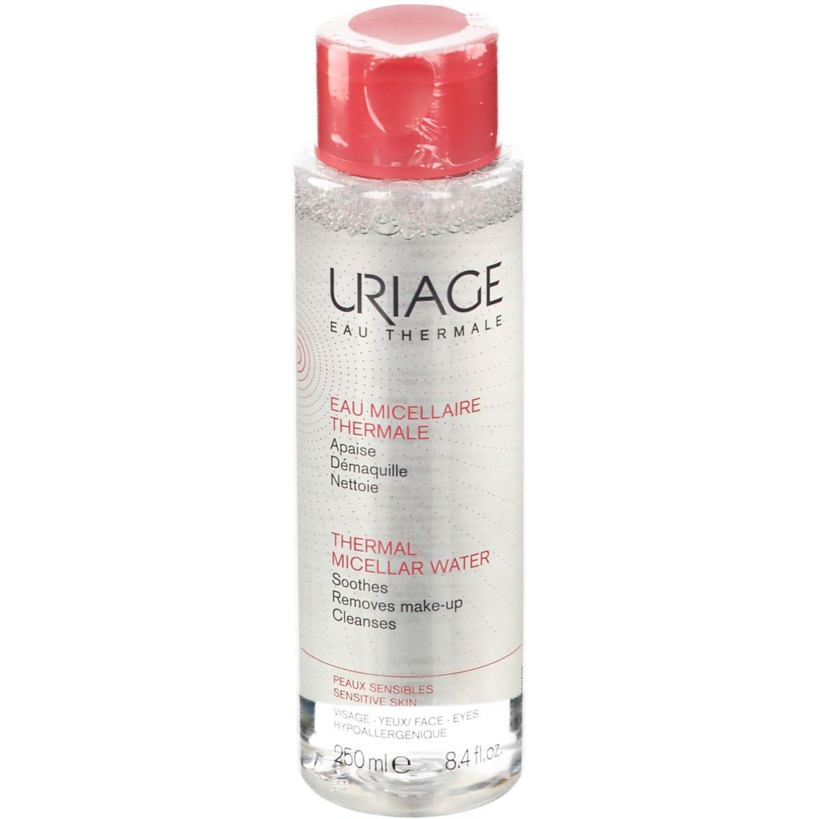 Flacone trasparente, tappo rosso. Scritta: URIAGE Eau Thermale. Testo: Thermal Micellar Water. Per pelli sensibili.