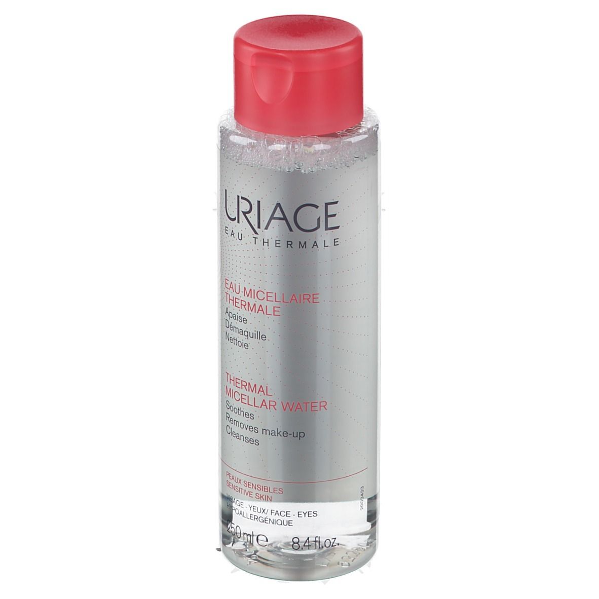 Flacone trasparente, tappo rosso. Scritta: URIAGE Eau Thermale. Testo: Thermal Micellar Water. Per pelli sensibili.