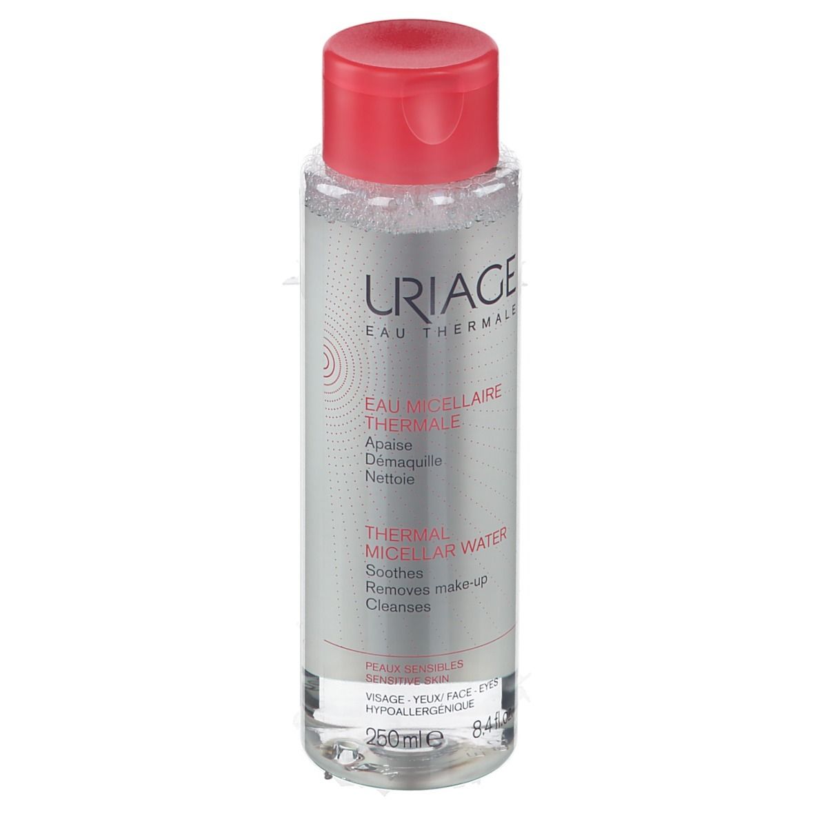 Flacone trasparente, tappo rosso. Scritta: URIAGE Eau Thermale. Testo: Thermal Micellar Water. Per pelli sensibili.