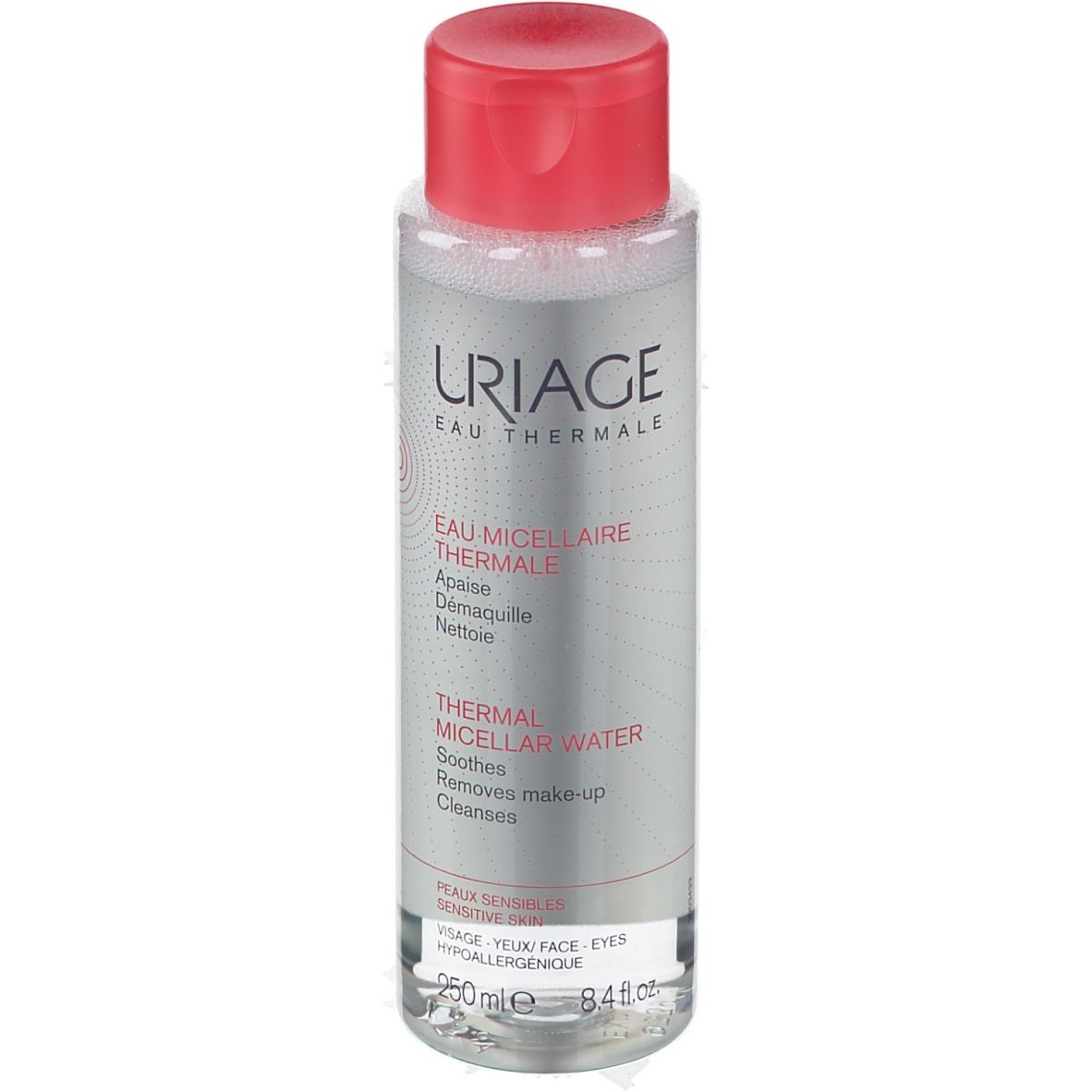 Flacone trasparente, tappo rosso. Scritta: URIAGE Eau Thermale. Testo: Thermal Micellar Water. Per pelli sensibili.