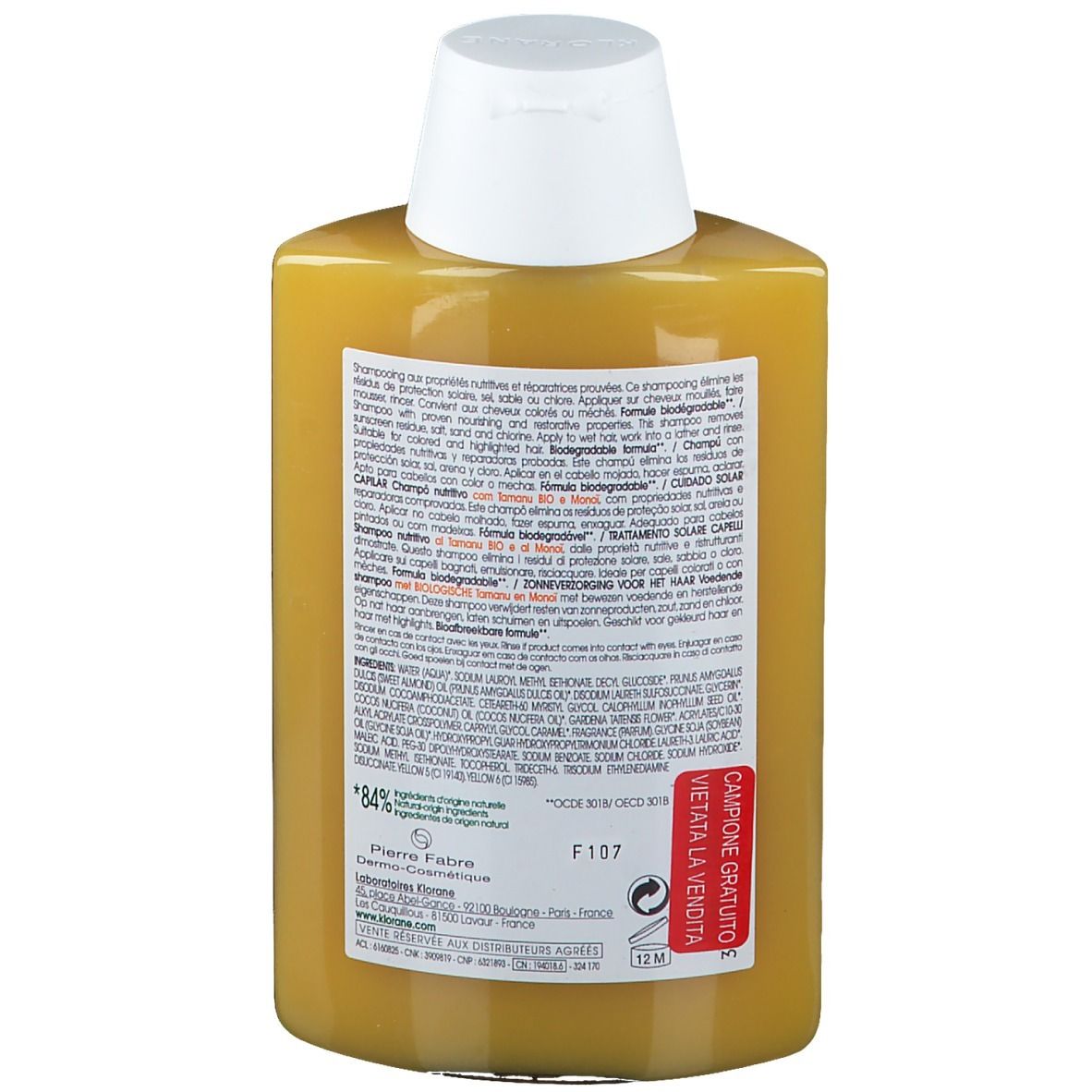 Retro del flacone di shampoo. Testo multilingue. Adesivo rosso: Campione Gratuito. 84% ingredienti naturali.
