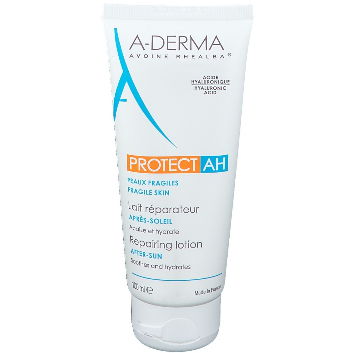 Tubo bianco con testo blu e arancione. Scritto: A-Derma, Protect AH, Après-Soleil, Lait réparateur.