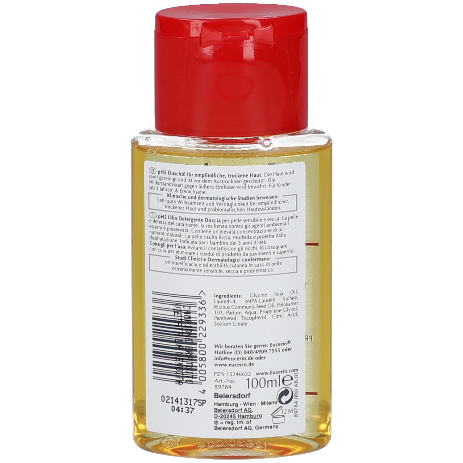 Retro del flacone di olio doccia con etichetta. Contiene informazioni sugli ingredienti e l'uso. Con tappo rosso.