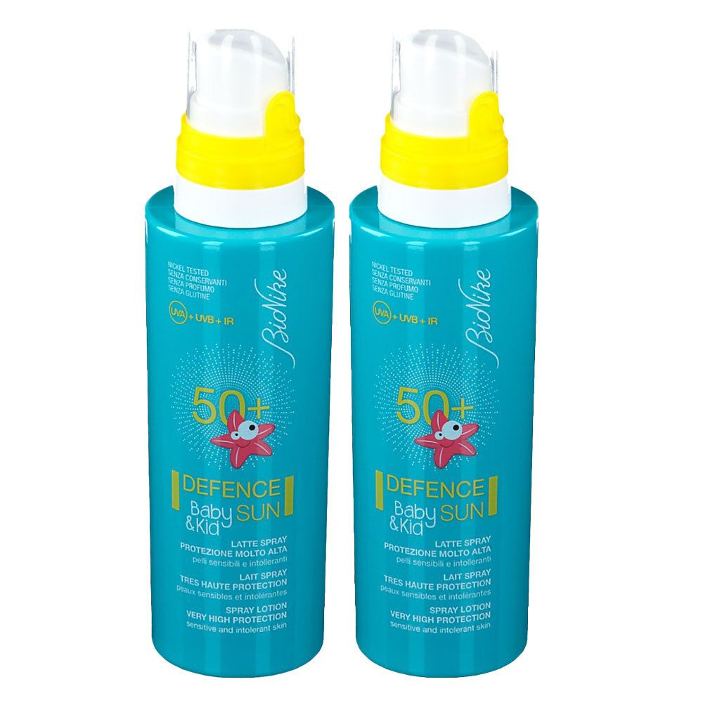 Due spray turchesi con tappi gialli. Scritta: BioNike, 50+, DEFENCE Baby & Kid SUN, SPF 50+.