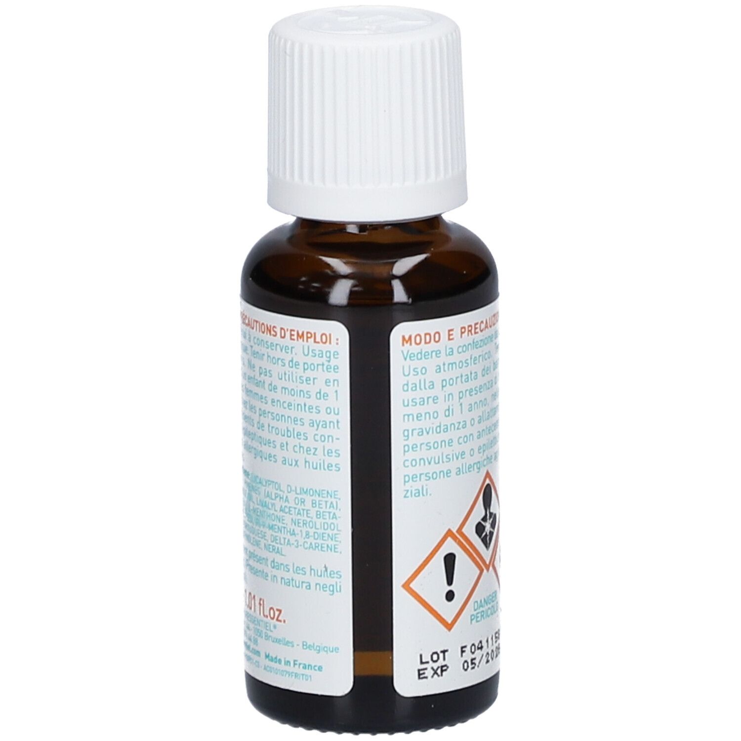 Flacone di vetro marrone con tappo bianco. Etichetta con ingredienti e avvertenze. Testo multilingue.