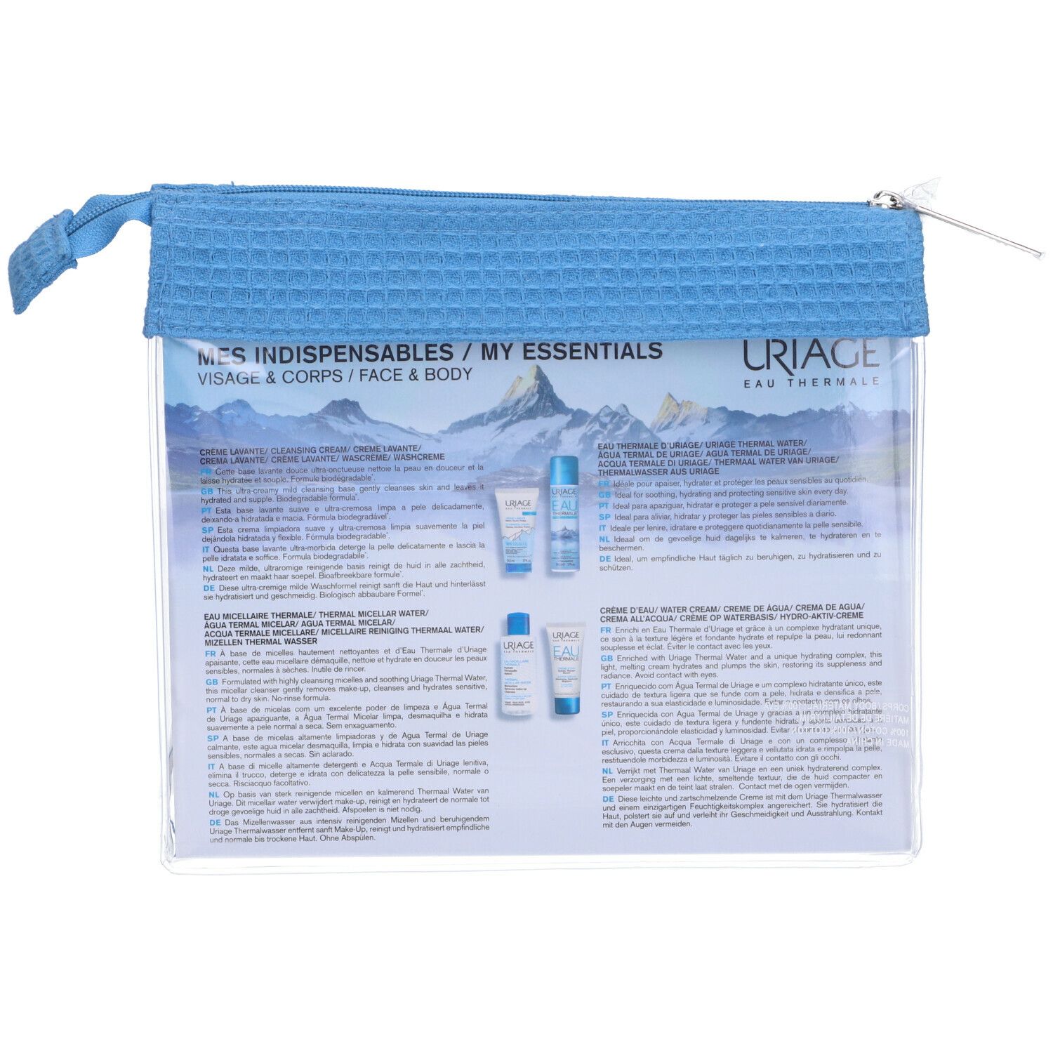 Retro della trousse con informazioni sui prodotti. Borsa blu con cerniera. Scritta: "MES INDISPENSABLES / MY ESSENTIALS".