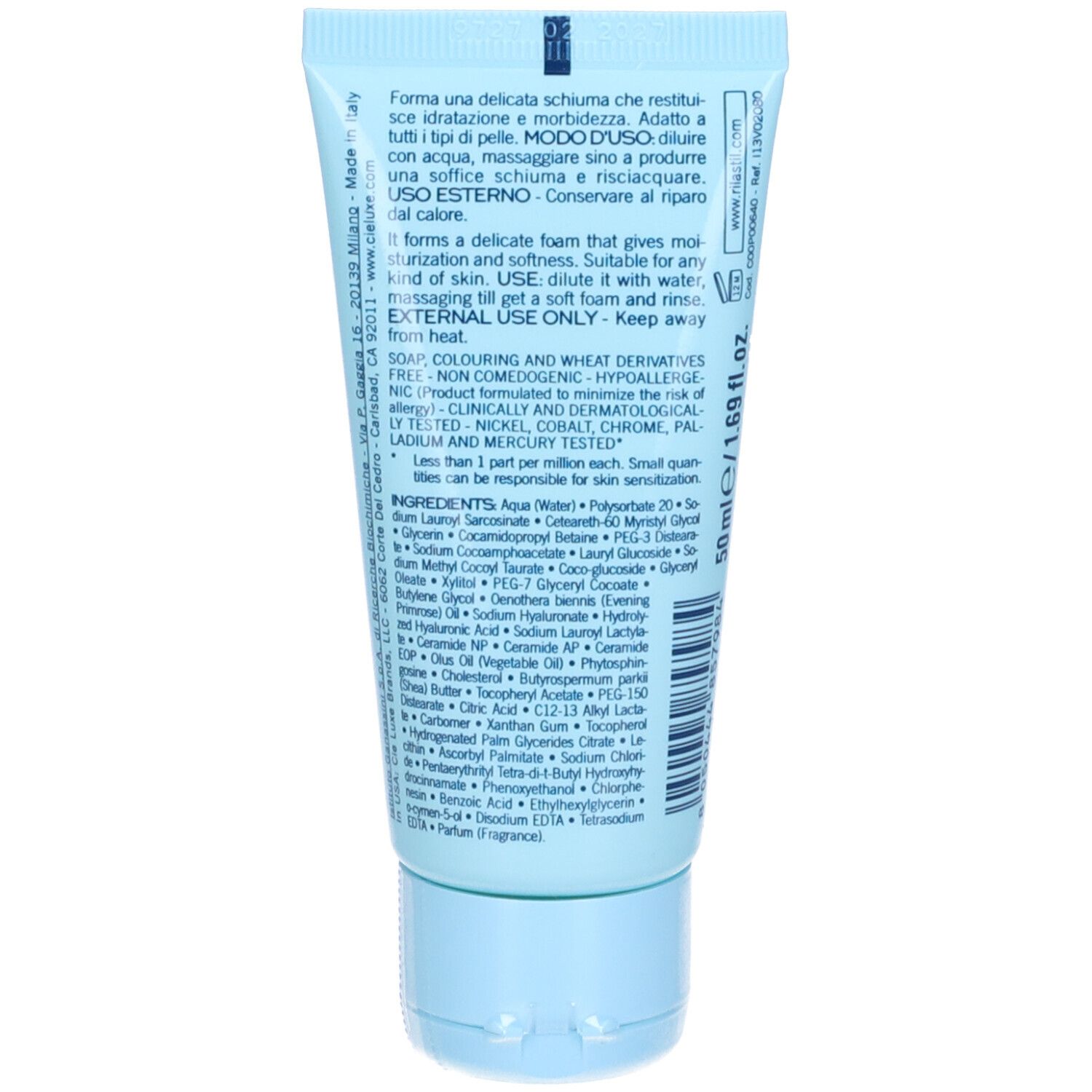 Retro del tubo con testo multilingue. Ingredienti e istruzioni. Sfondo azzurro.