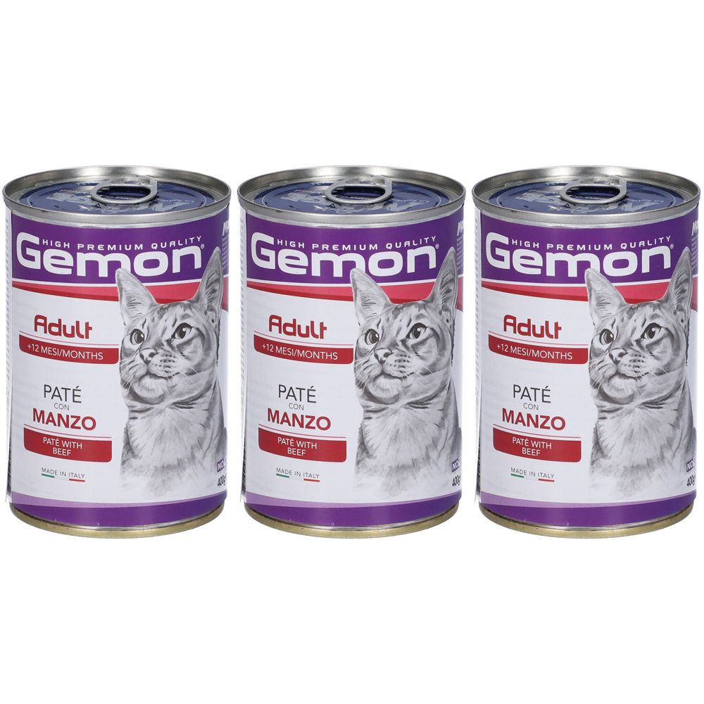 Tre lattine di cibo per gatti. Scritta: Gemon, Adult, Paté con Manzo. Immagine di un gatto. Confezione viola e bianca.