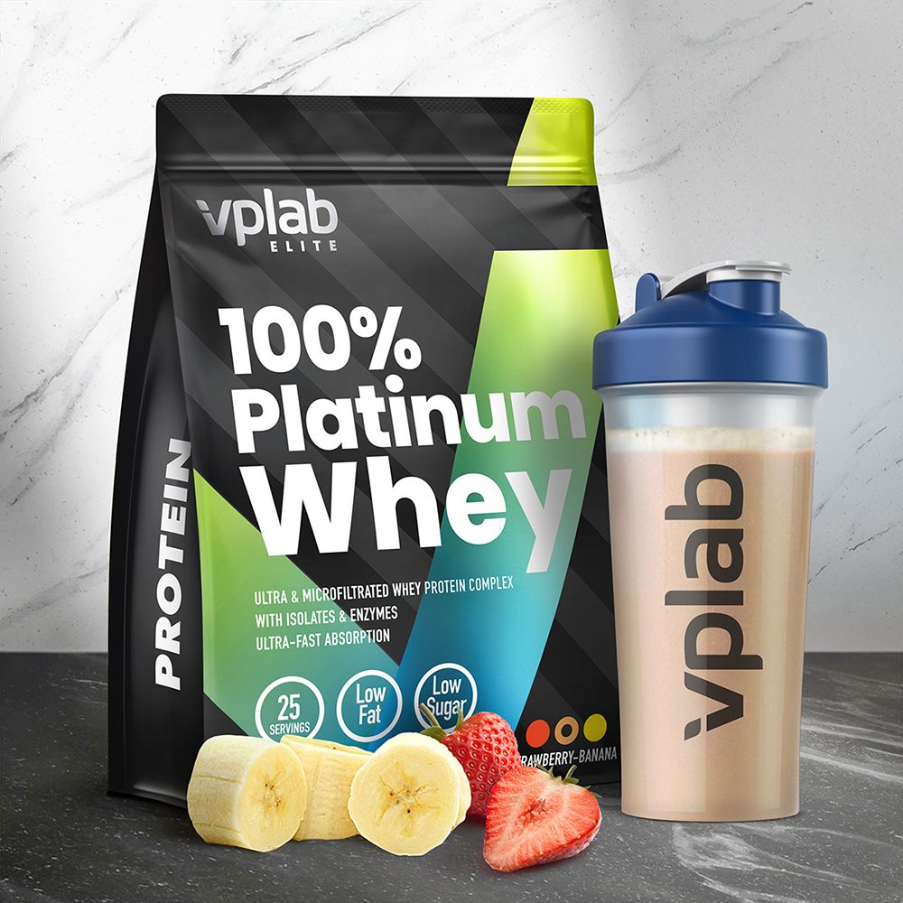 Confezione, shaker, fette di banana e fragole. Scritta: "Vplab Elite 100% Platinum Whey".