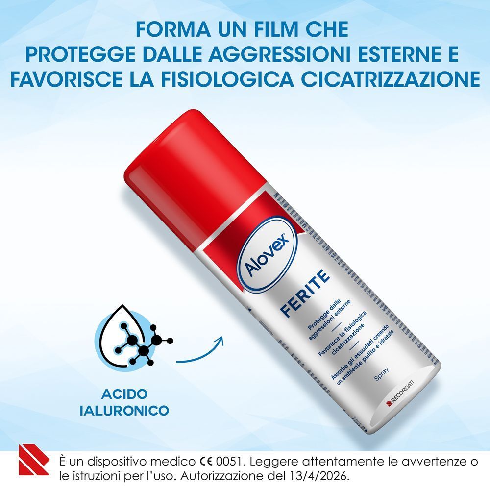 Una bomboletta spray Alovex Ferite con tappo rosso, corpo argentato ed etichetta bianca, con simbolo molecolare.