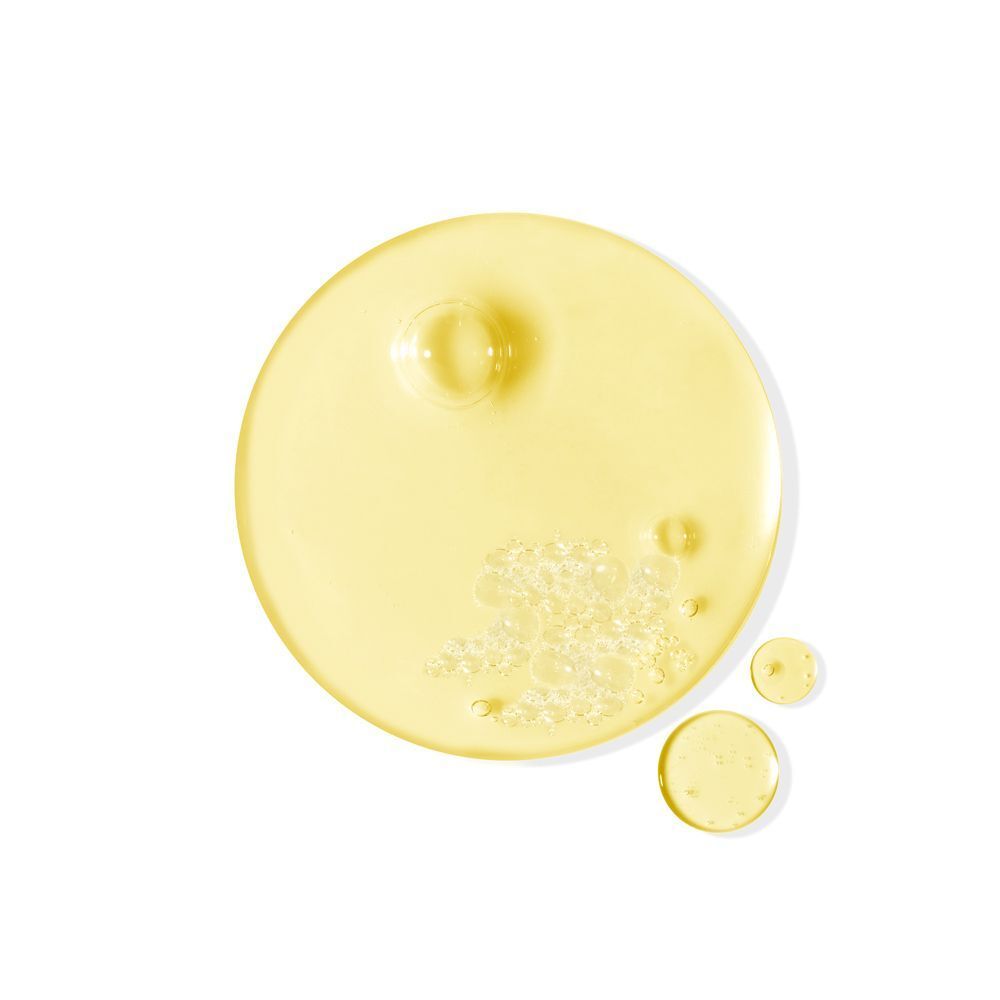 Gocce di olio lavante A-Derma Exomega Control con bollicine.
