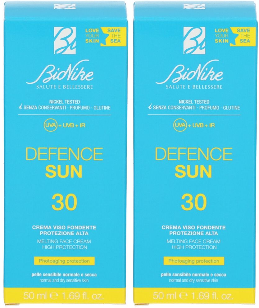 Due confezioni blu identiche. Scritta: BioNike Defence Sun 30, crema viso. Contiene protezione UVA, UVB e IR.