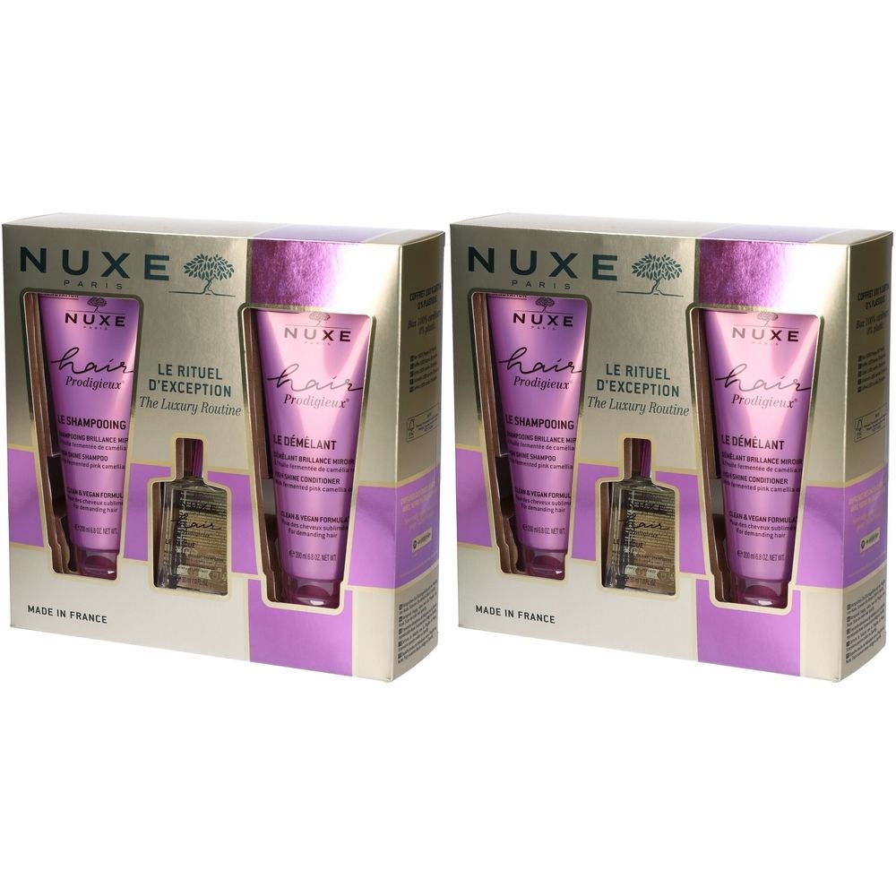 Due cofanetti regalo di prodotti per capelli. Ogni set contiene un tubetto di shampoo, un tubetto di balsamo e una piccola bottiglia di olio. Marchio: Nuxe.