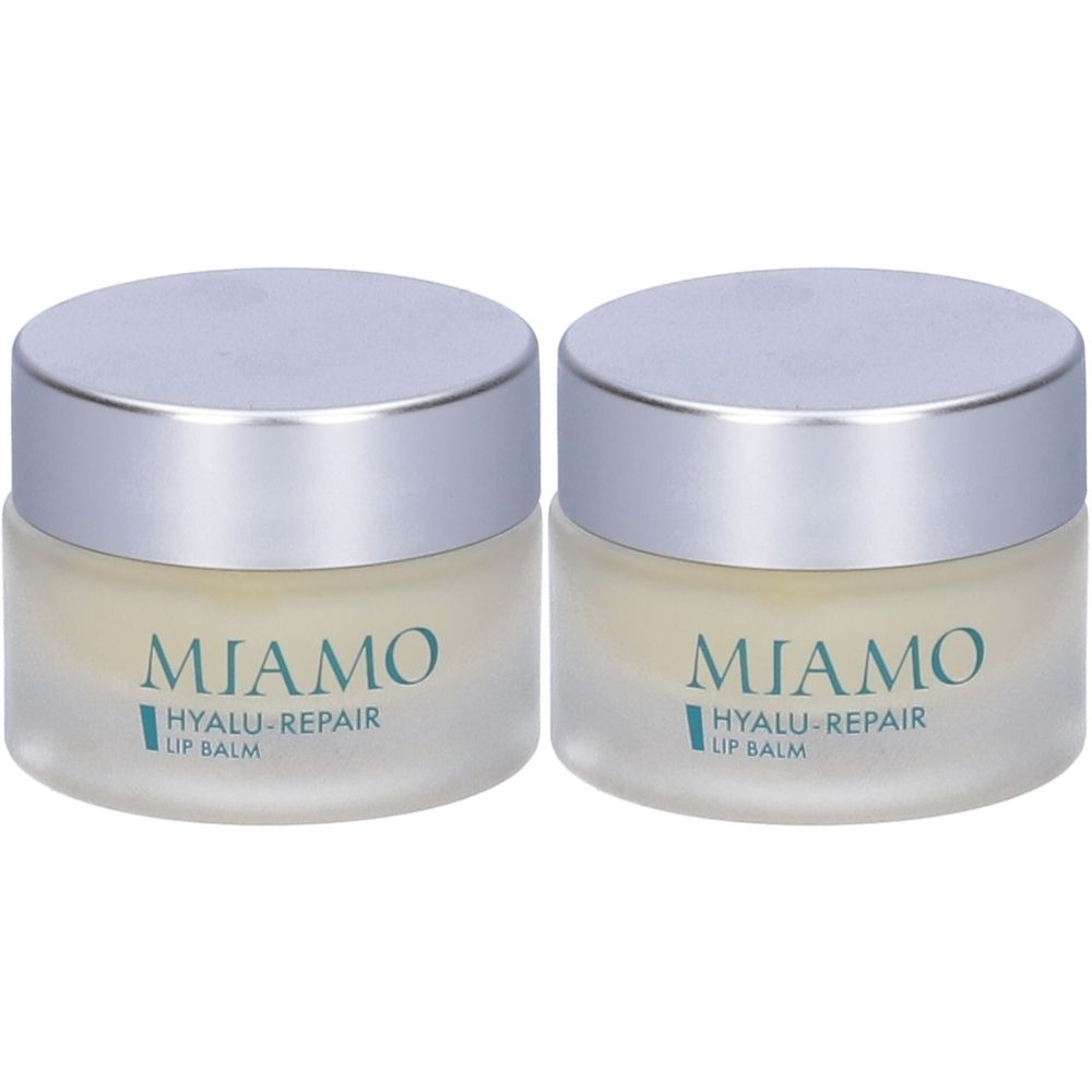 Due vasetti di balsamo labbra. Scritta: MIAMO Hyalu-Repair Lip Balm. Coperchi argentati, vasetti satinati.
