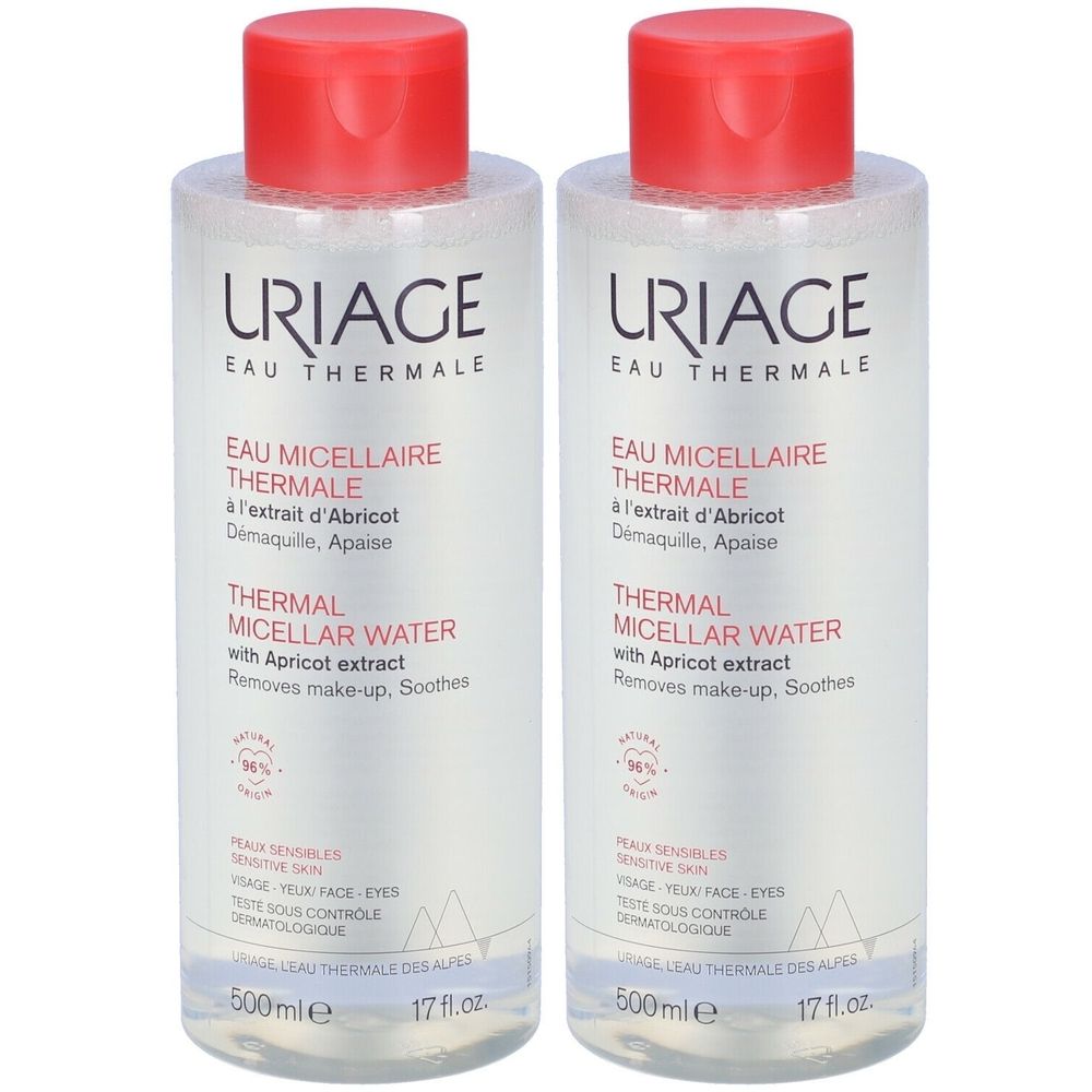 Due bottiglie di Uriage Thermal Micellar Water. Tappi rossi, bottiglie bianche con etichette. Testo: Eau Thermale, Micellaire, Thermal Water.