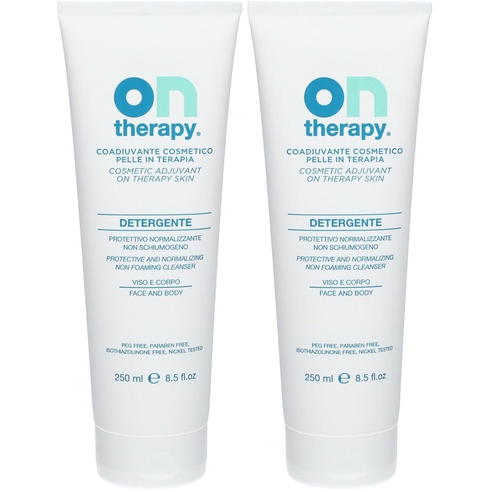 Due tubi bianchi con scritte blu. On Therapy, Detergente, 250 ml. Per viso e corpo.