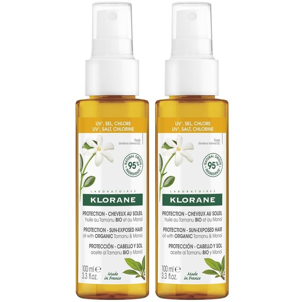 Due flaconi spray con liquido giallo. Scritta: Klorane, protezione capelli esposti al sole. Con Tamanu BIO e Monoï.