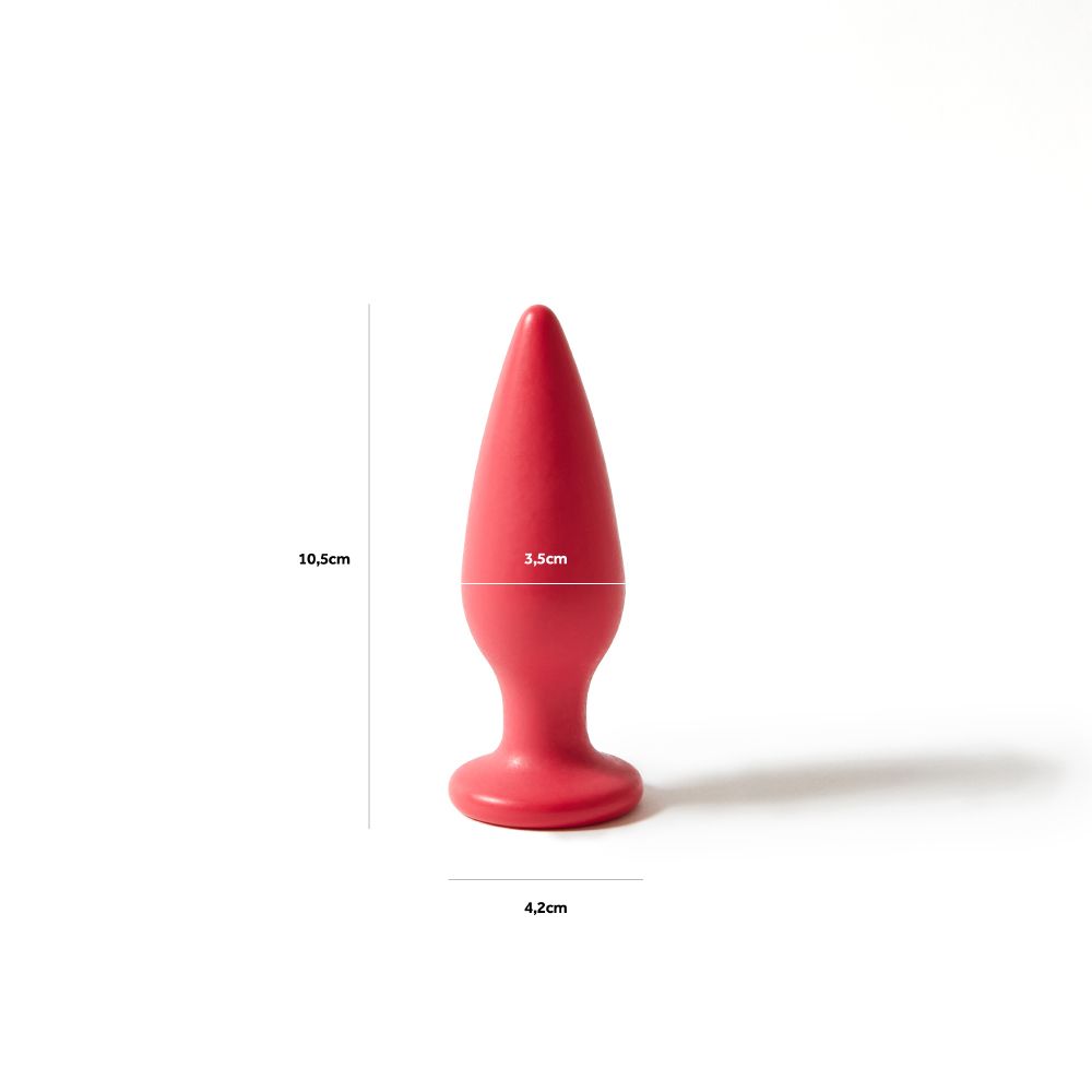 Plug anale rosso con dimensioni: 10,5 cm altezza, 3,5 cm larghezza, base 4,2 cm. Sfondo bianco.