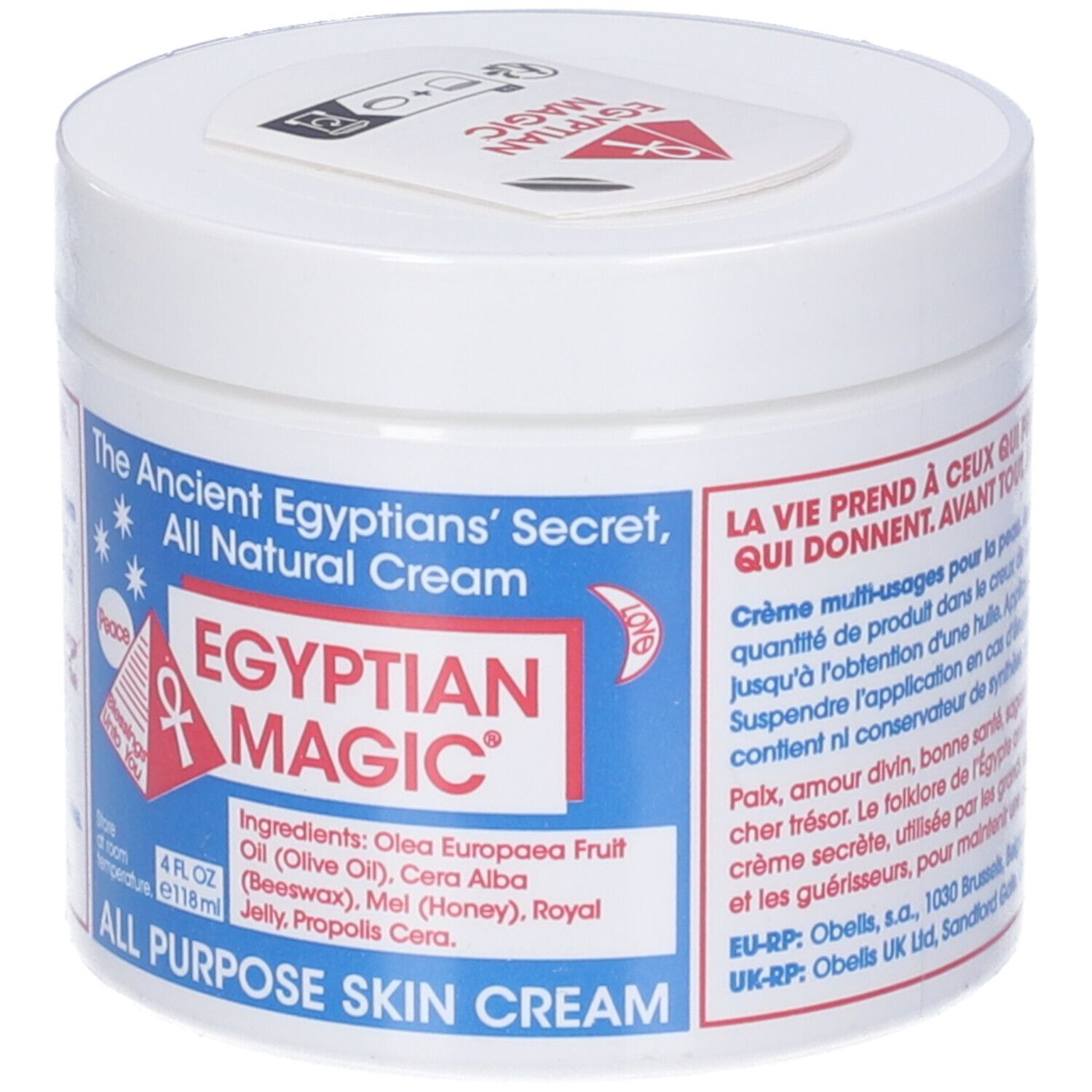 Vasetto bianco con coperchio. Scritta: Egyptian Magic, All Purpose Skin Cream. Stampa rossa e blu. Elenco ingredienti.