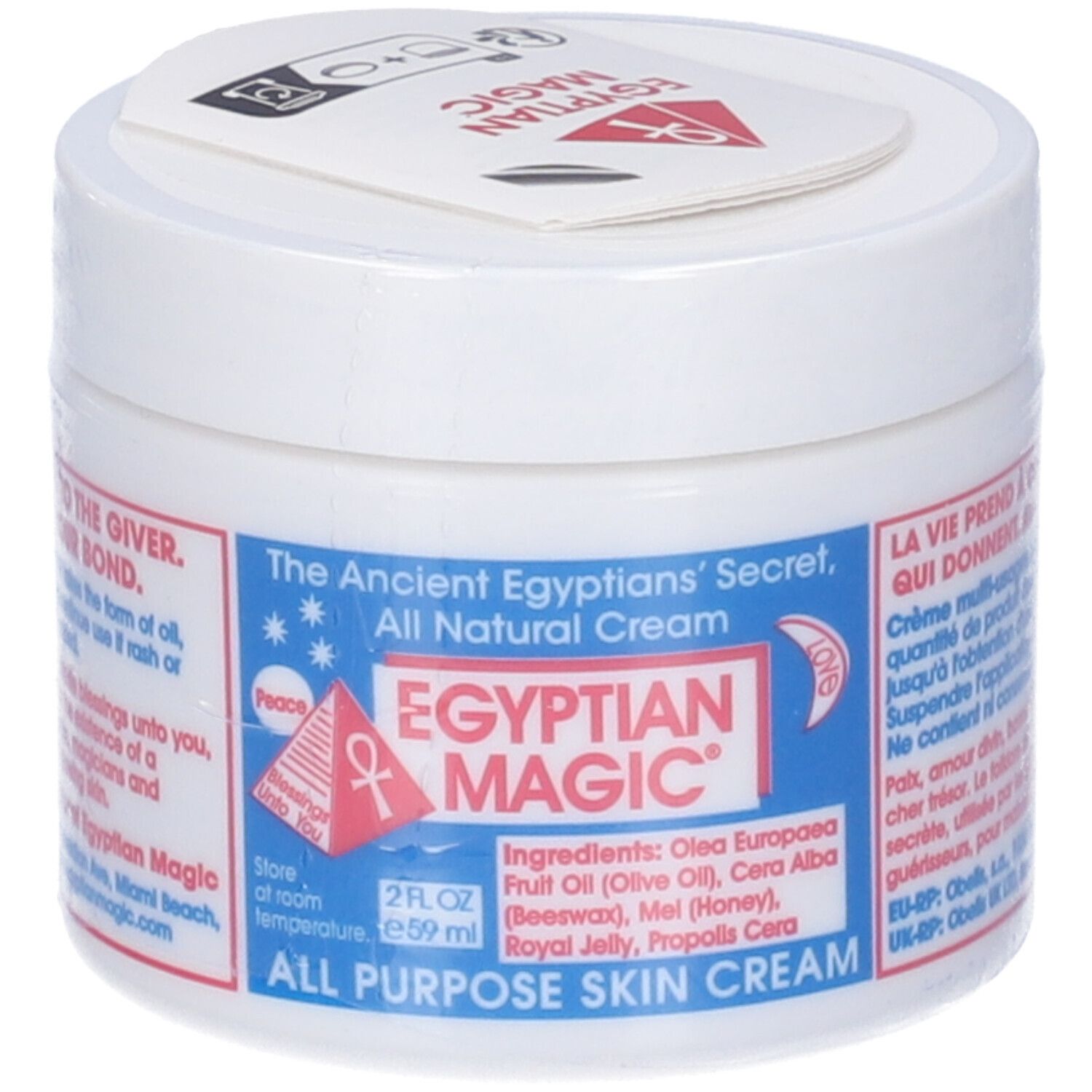 Vasetto bianco con etichetta blu. Testo: Egyptian Magic, All Purpose Skin Cream. Elenco ingredienti. Coperchio con logo.