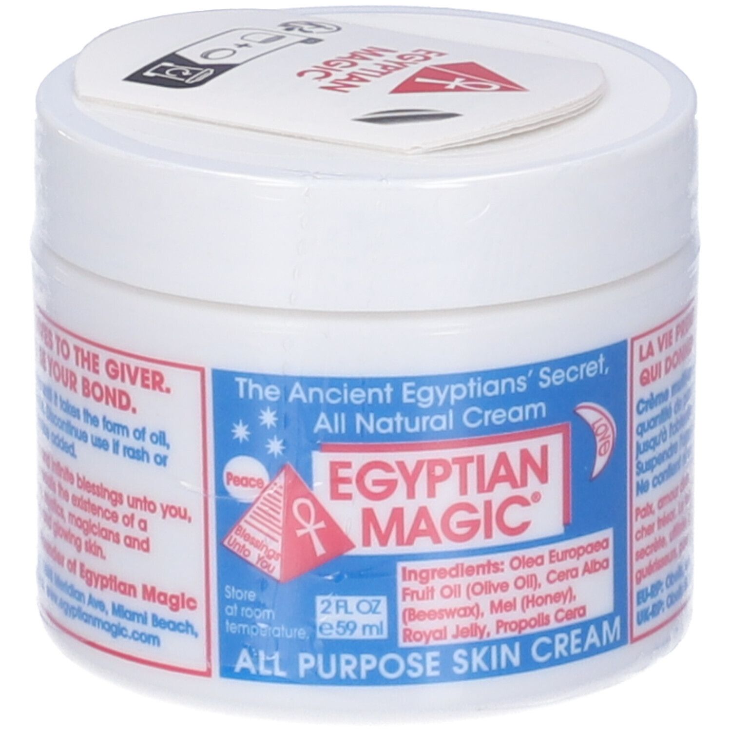 Vasetto bianco con etichetta blu. Testo: Egyptian Magic, All Purpose Skin Cream. Elenco ingredienti. Coperchio con logo.