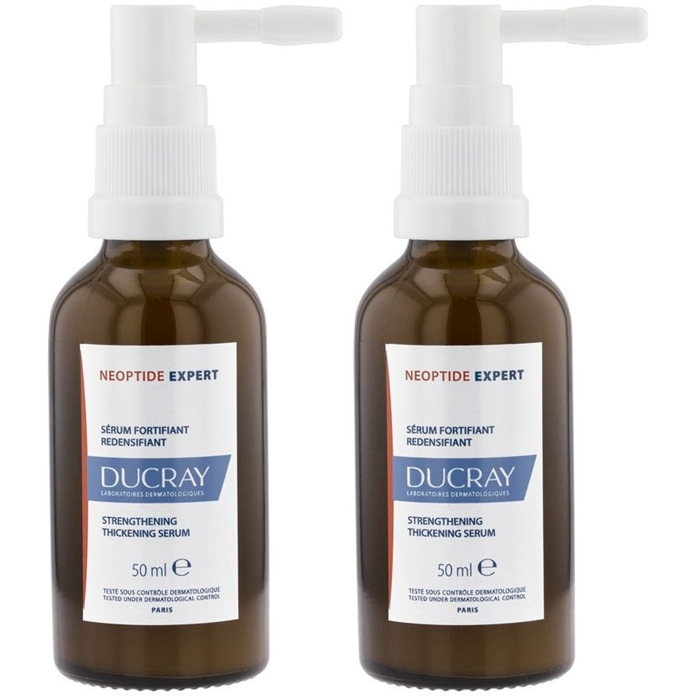 Due flaconi di vetro marrone con erogatore bianco. Etichette con "NEOPTIDE EXPERT" e "DUCRAY". Ogni flacone contiene 50 ml.