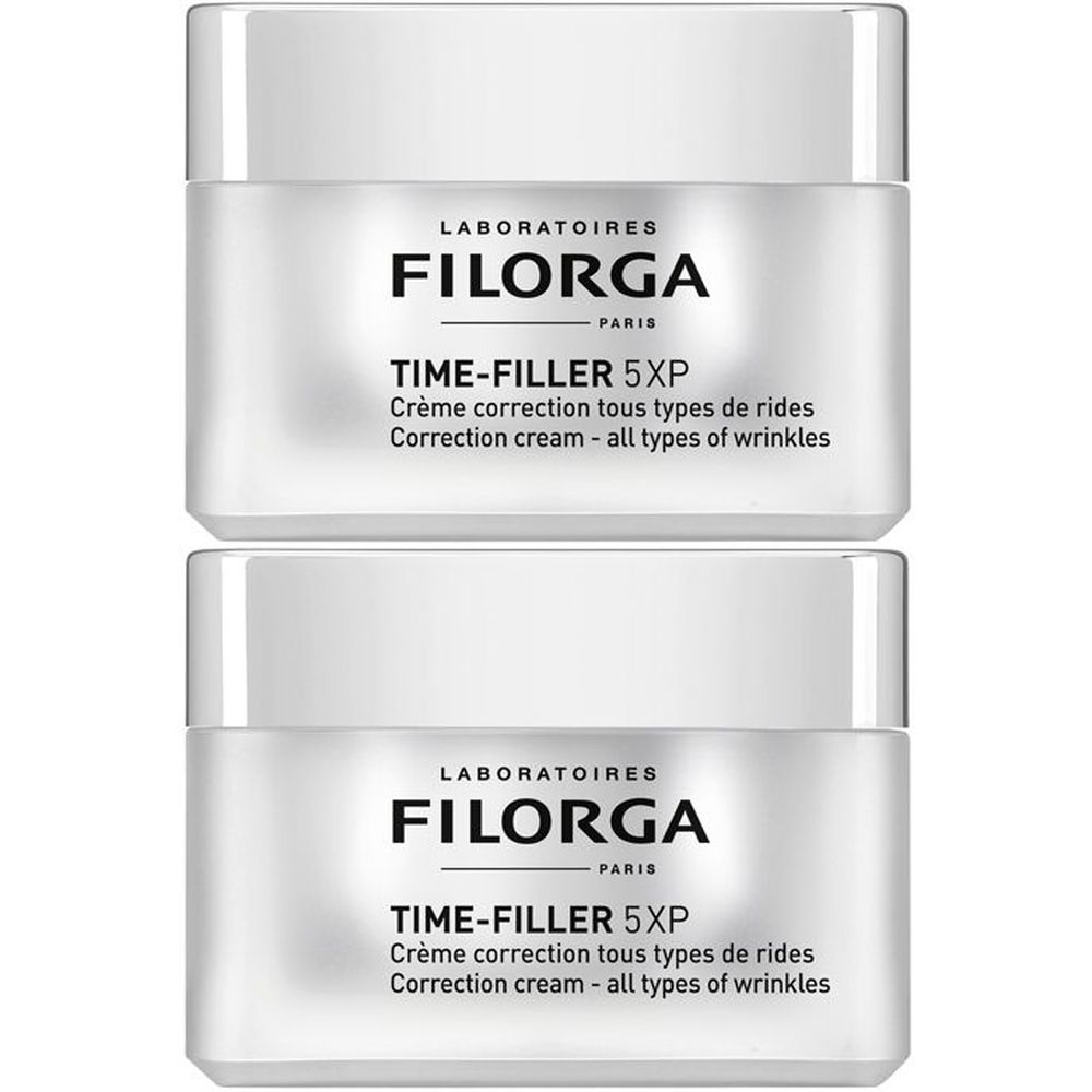 Due vasetti bianchi con coperchi. Scritta: FILORGA, TIME-FILLER 5XP. Denominazioni prodotto in francese e inglese.