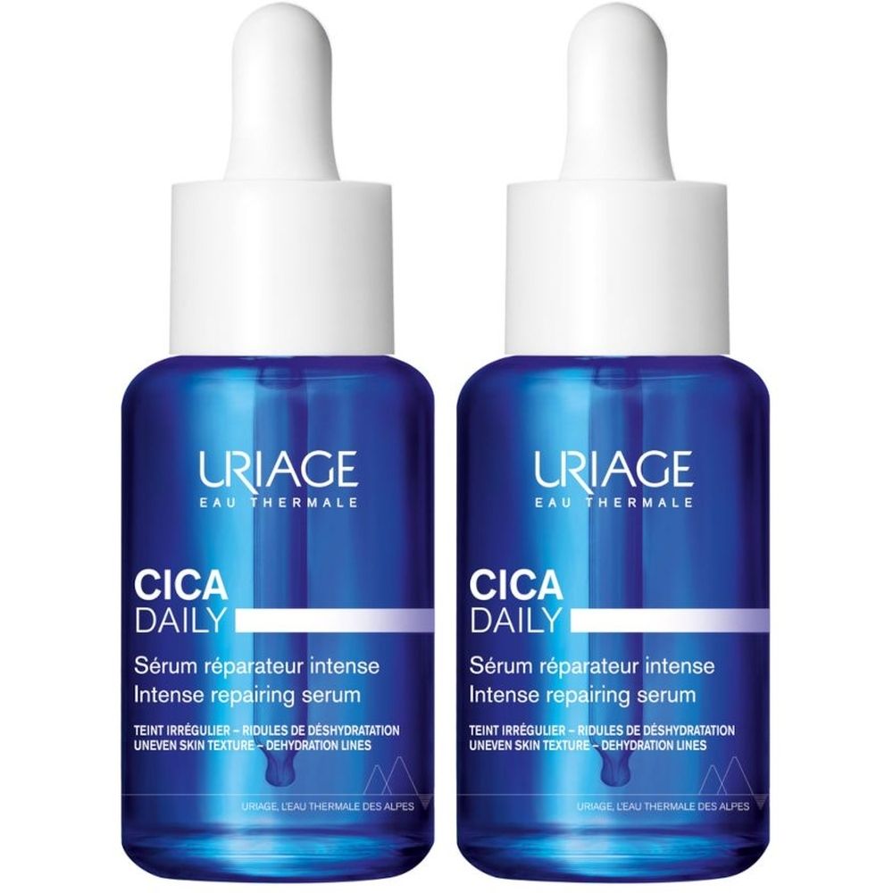 Due flaconi blu con tappi bianchi. Scritta: URIAGE, Cica Daily, Siero riparatore intenso. Testo: Uneven skin texture.