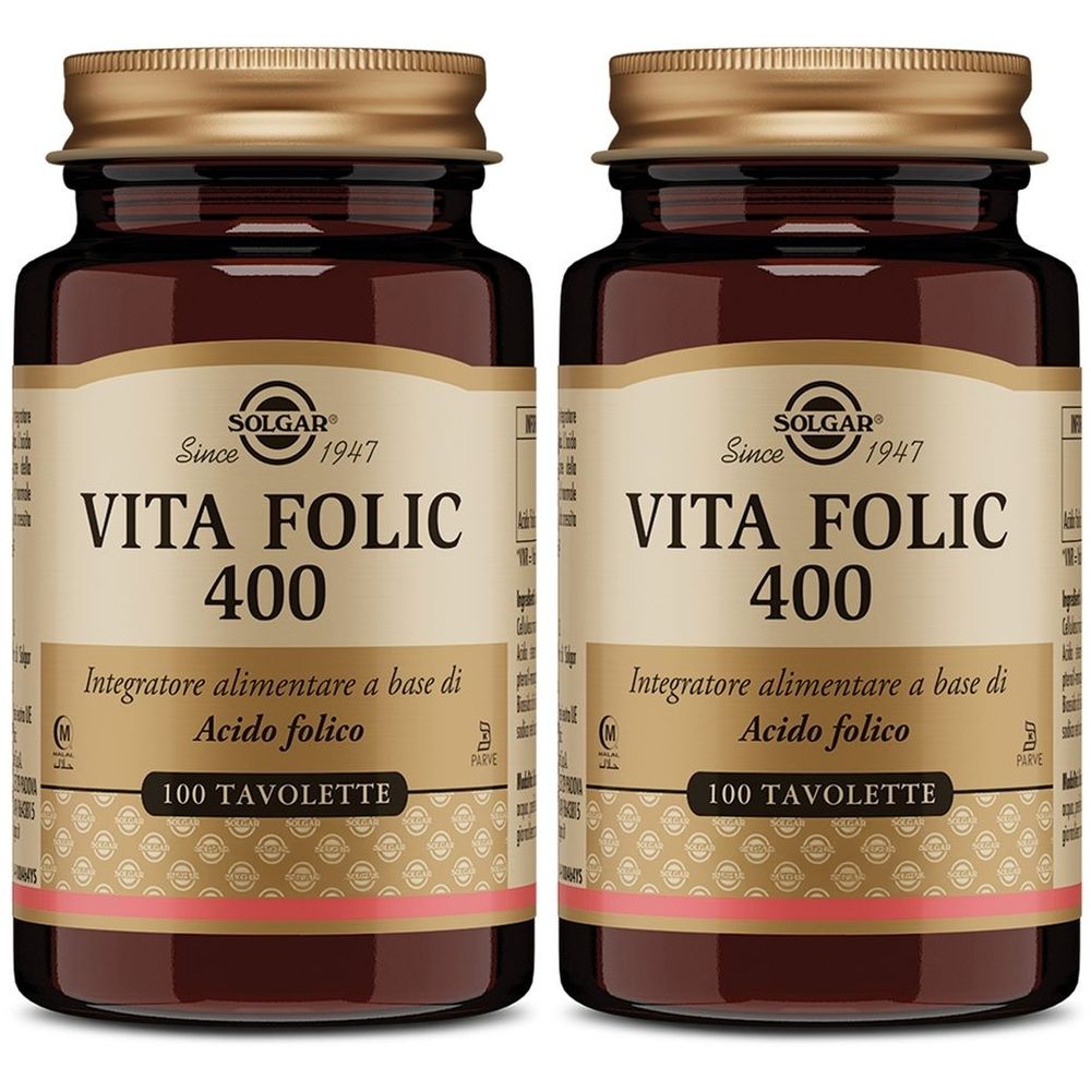 Due bottiglie di vetro marrone con tappi dorati. Le etichette riportano "SOLGAR Vita Folic 400". Ogni bottiglia contiene 100 compresse.