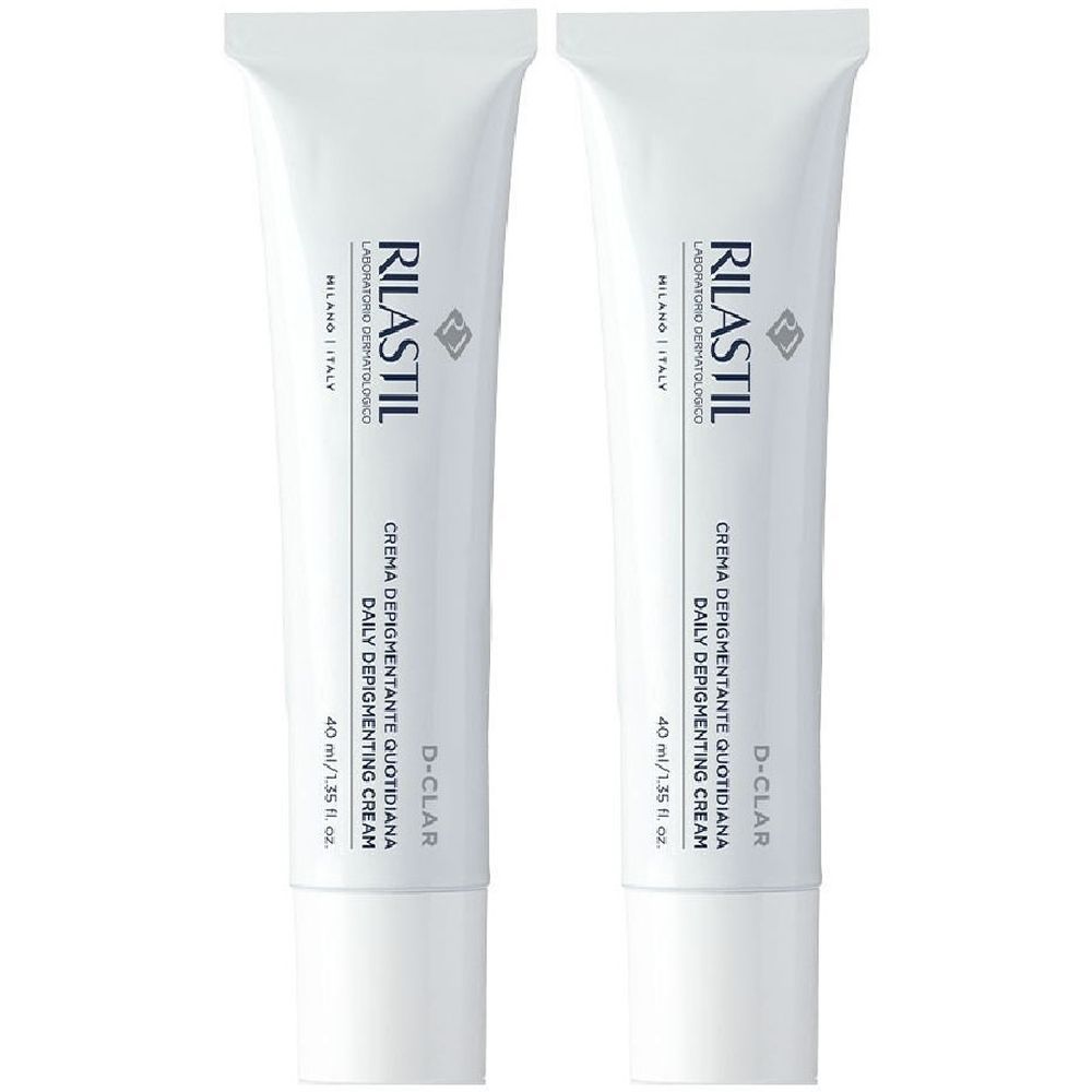Due tubi bianchi con scritte. Scritte: RILASTIL, D-CLAR, CREMA DEPIGMENTANTE QUOTIDIANA, DAILY DEPIGMENTING CREAM. 40 ml.