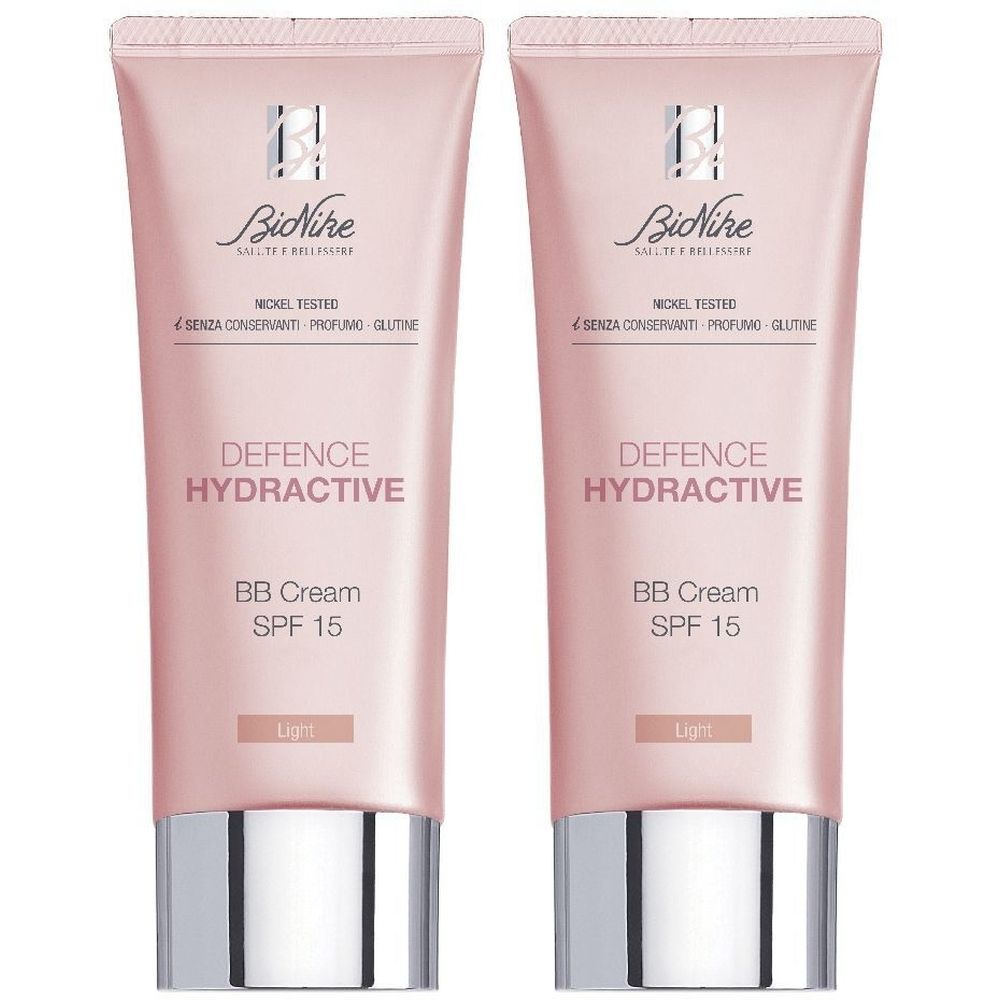 Due tubi di crema BB rosa con tappi argentati. Scritta: DEFENCE HYDRACTIVE, BB Cream SPF 15, Light. Marchio: BioNike.